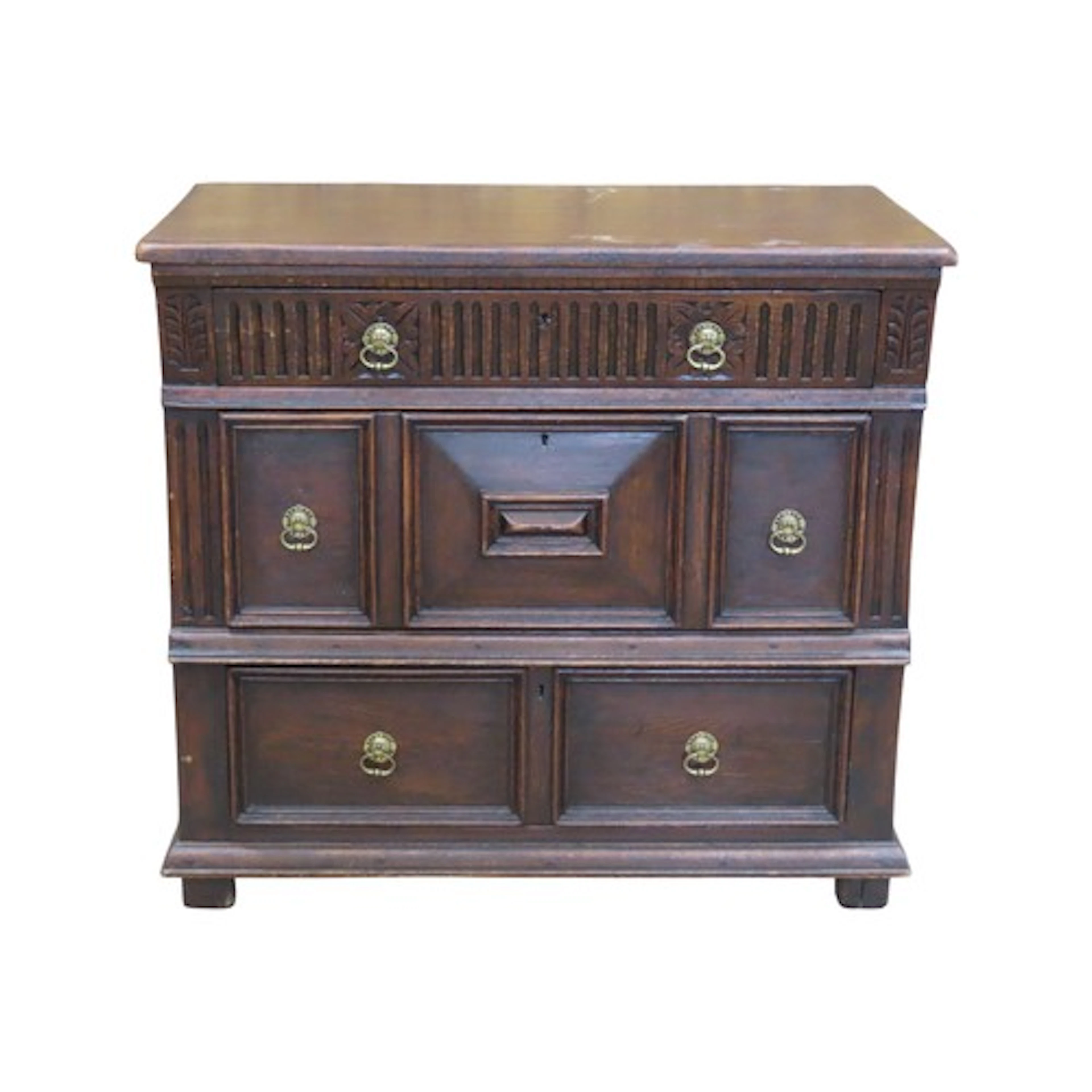 An antique Jacobean revival oak chest of three long drawers ...