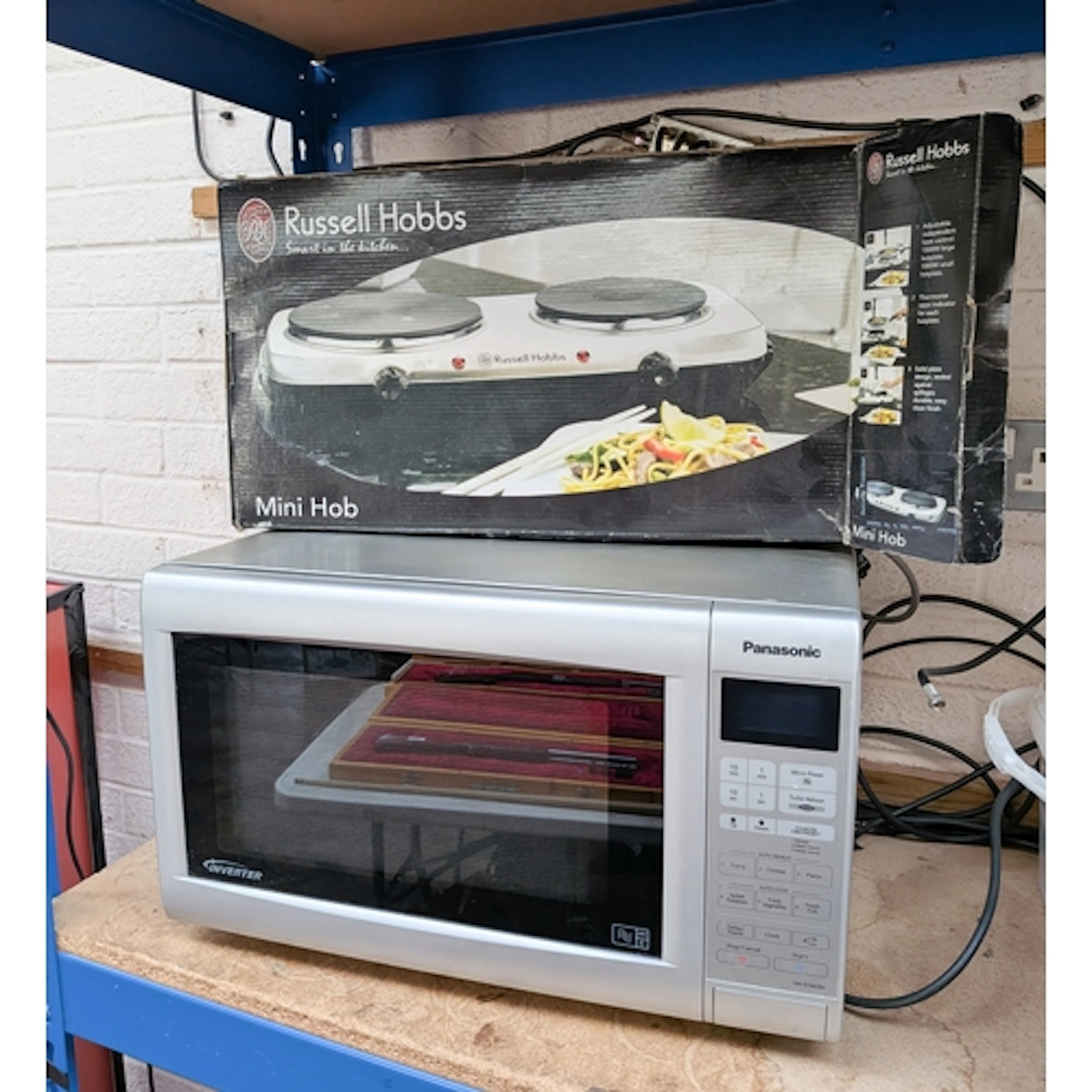 Panasonic inverter microwave oven and a boxed Russell Hobbs ...