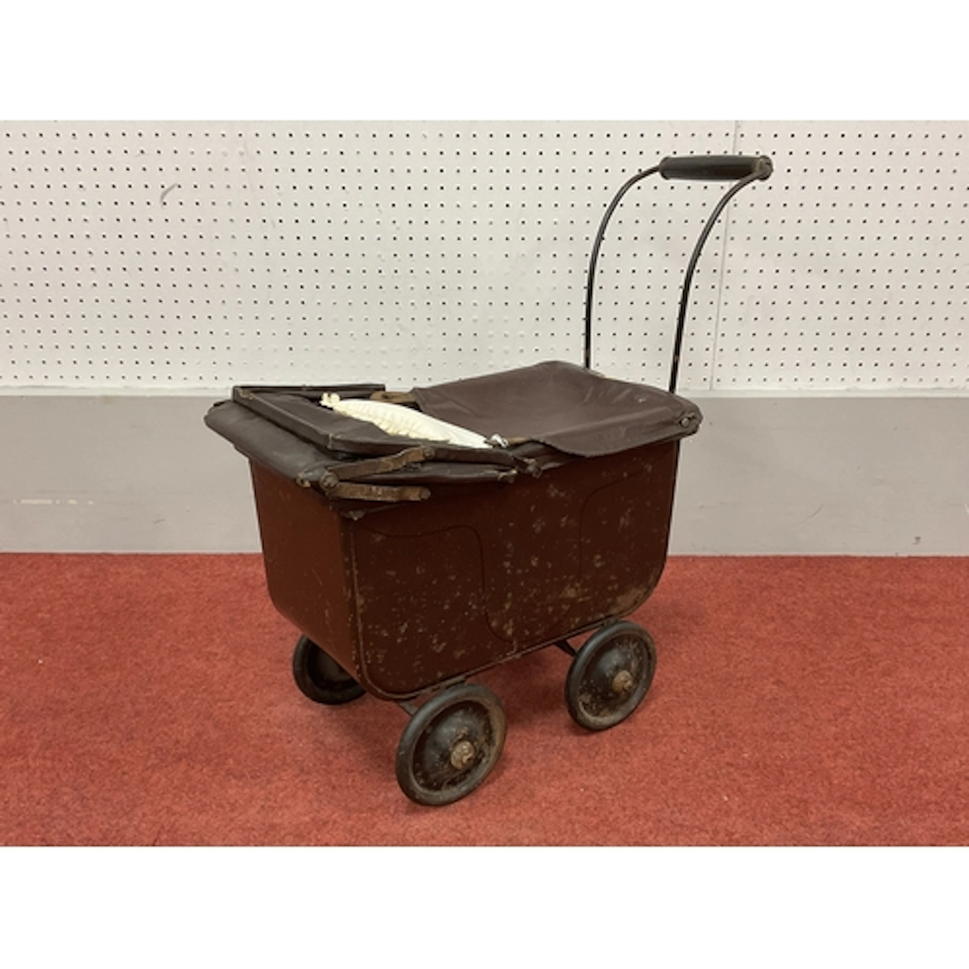 A Early XX Century Dolls Pram, wooden construction, marked m...