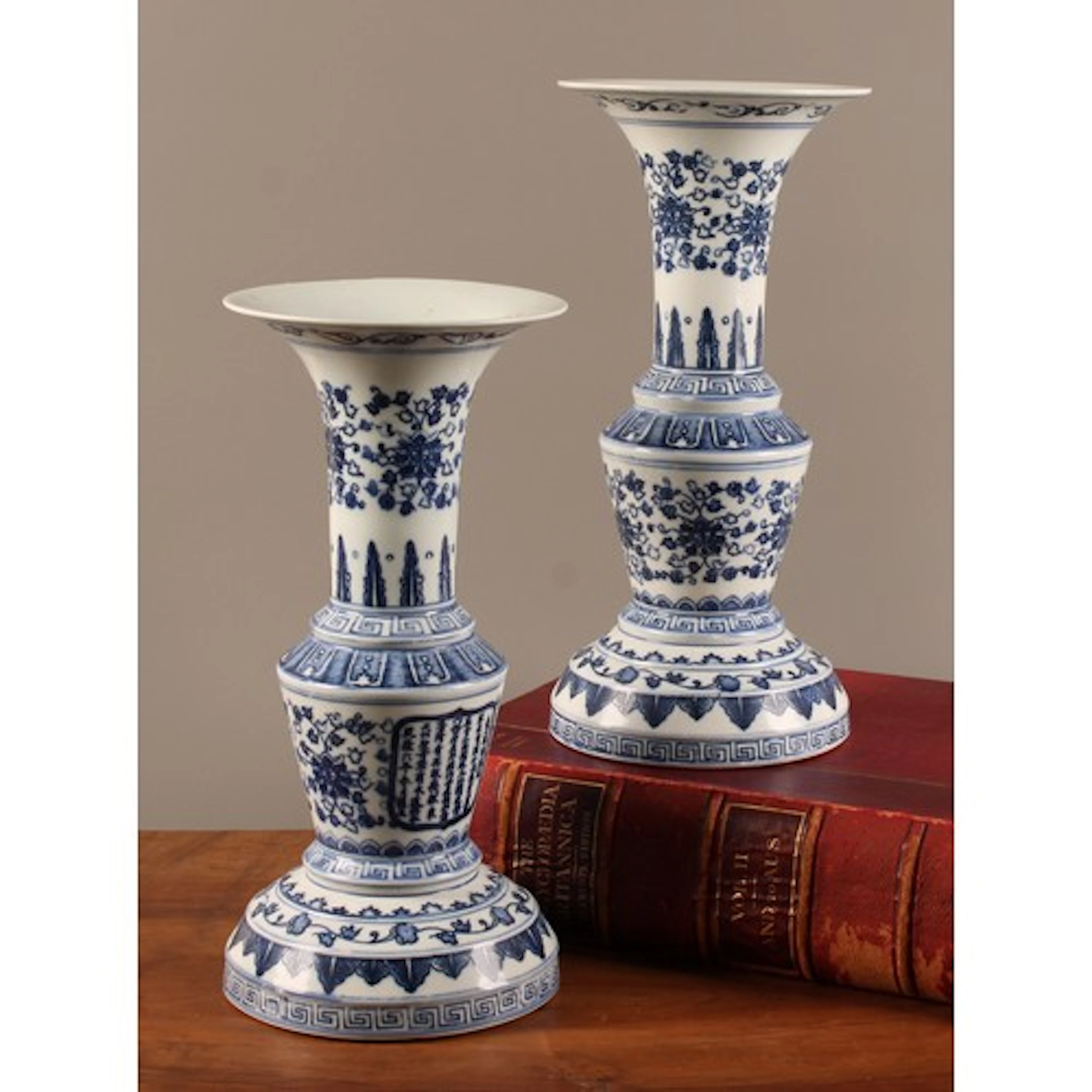 A pair of Chinese blue and white gu form altar vases, in the...