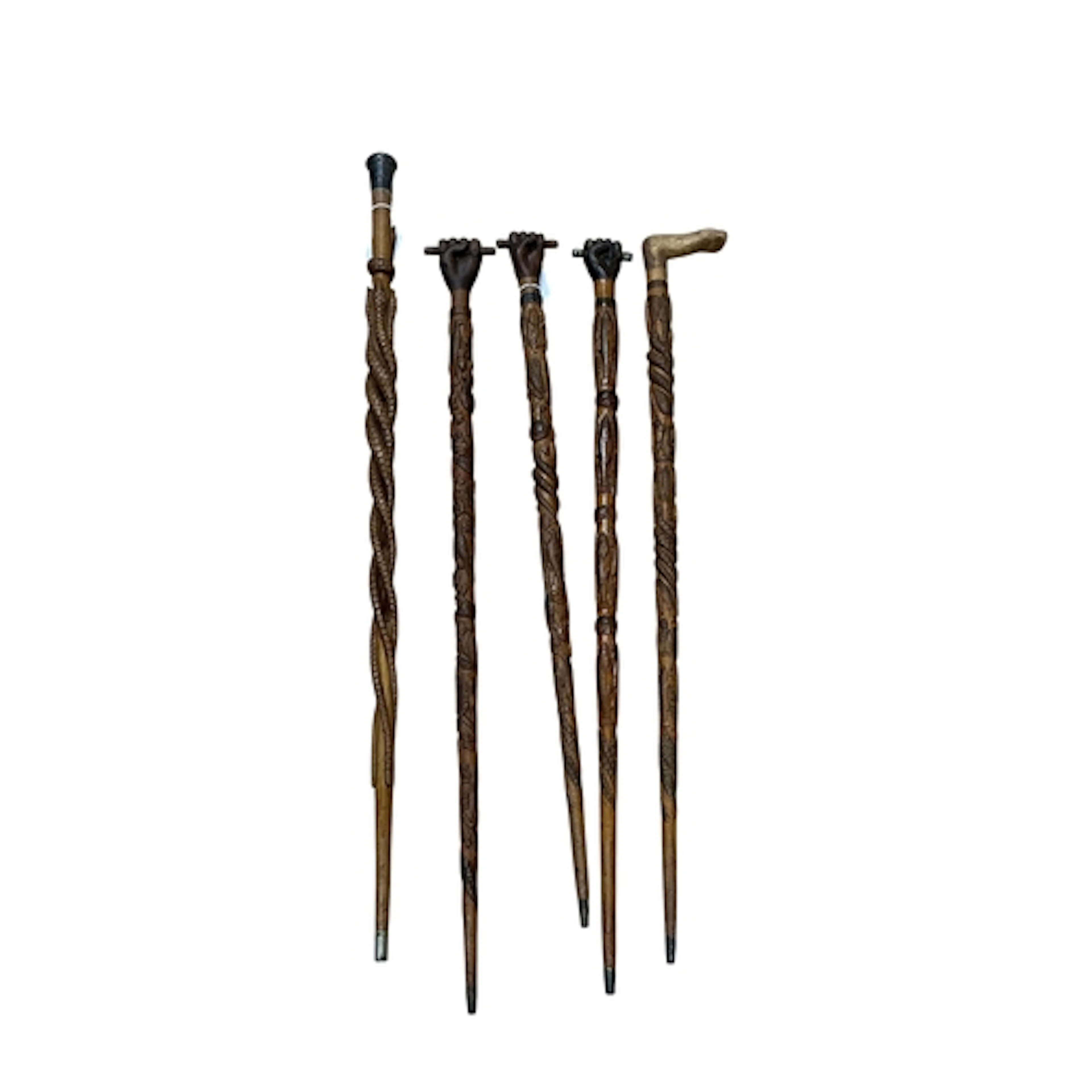 Welsh Folk Art - a group of five carved wood walking sticks,...