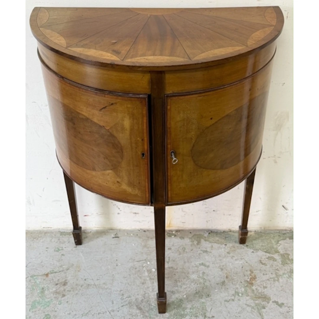 A demi-lune side cabinet with fan inlaid top