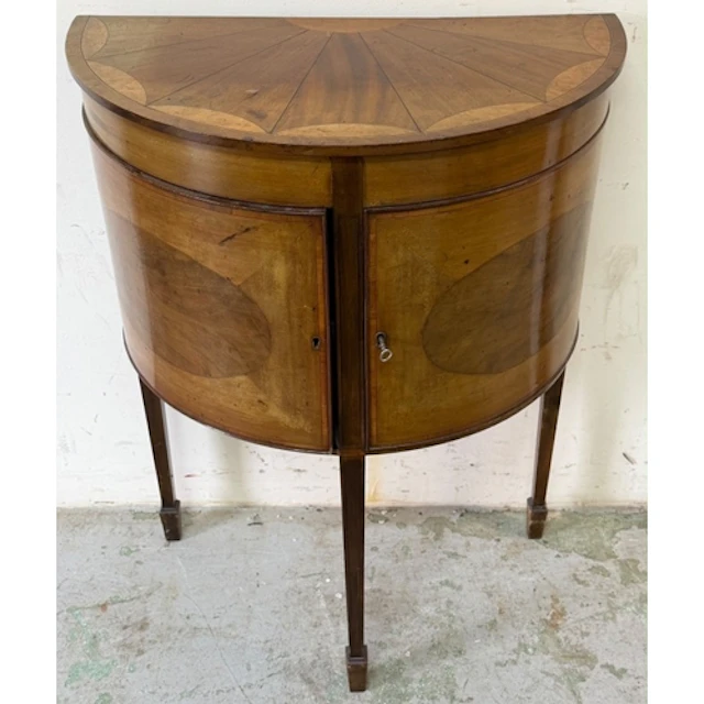 A demi-lune side cabinet with fan inlaid top