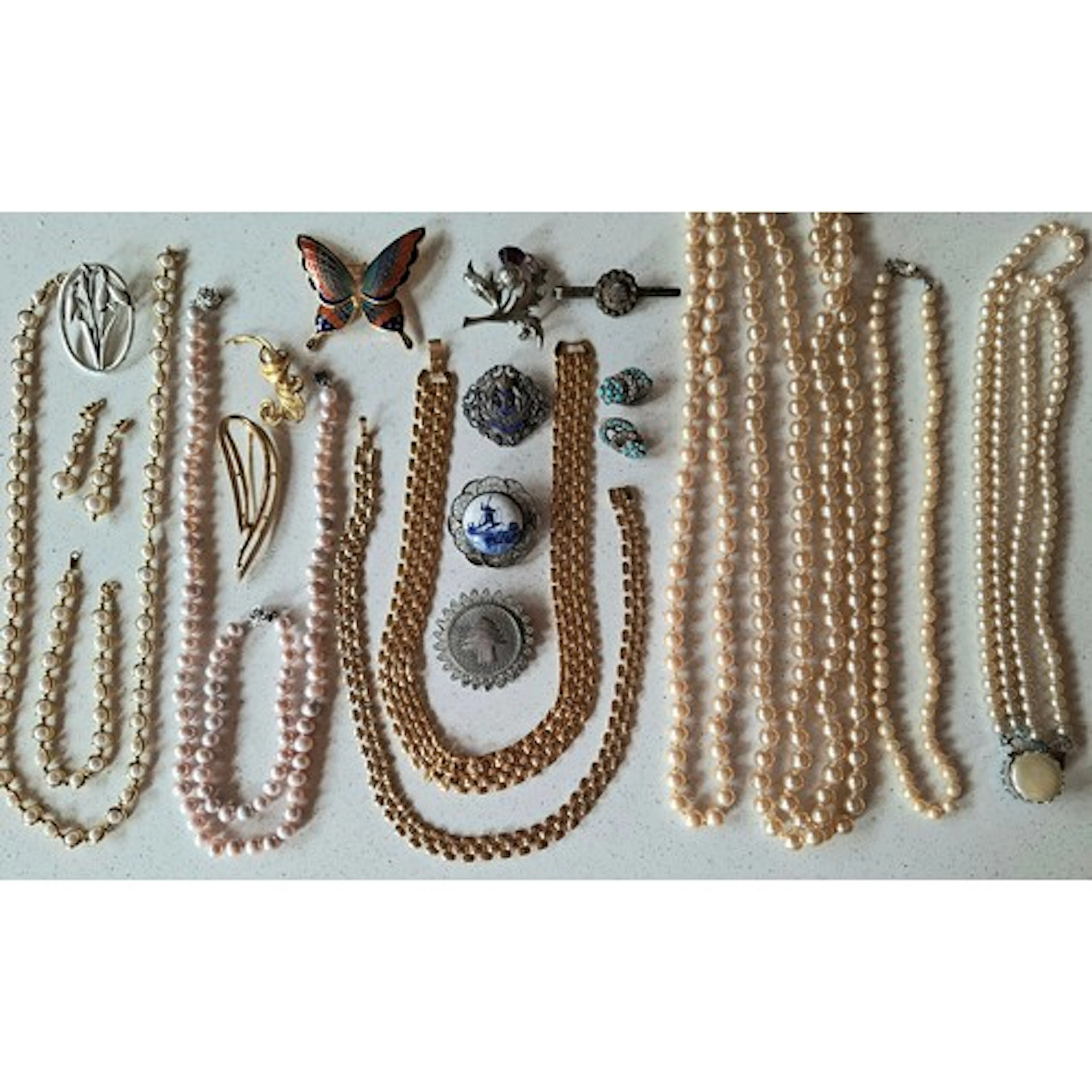 A quantity of costume jewellery to include a Royal Navy swee...