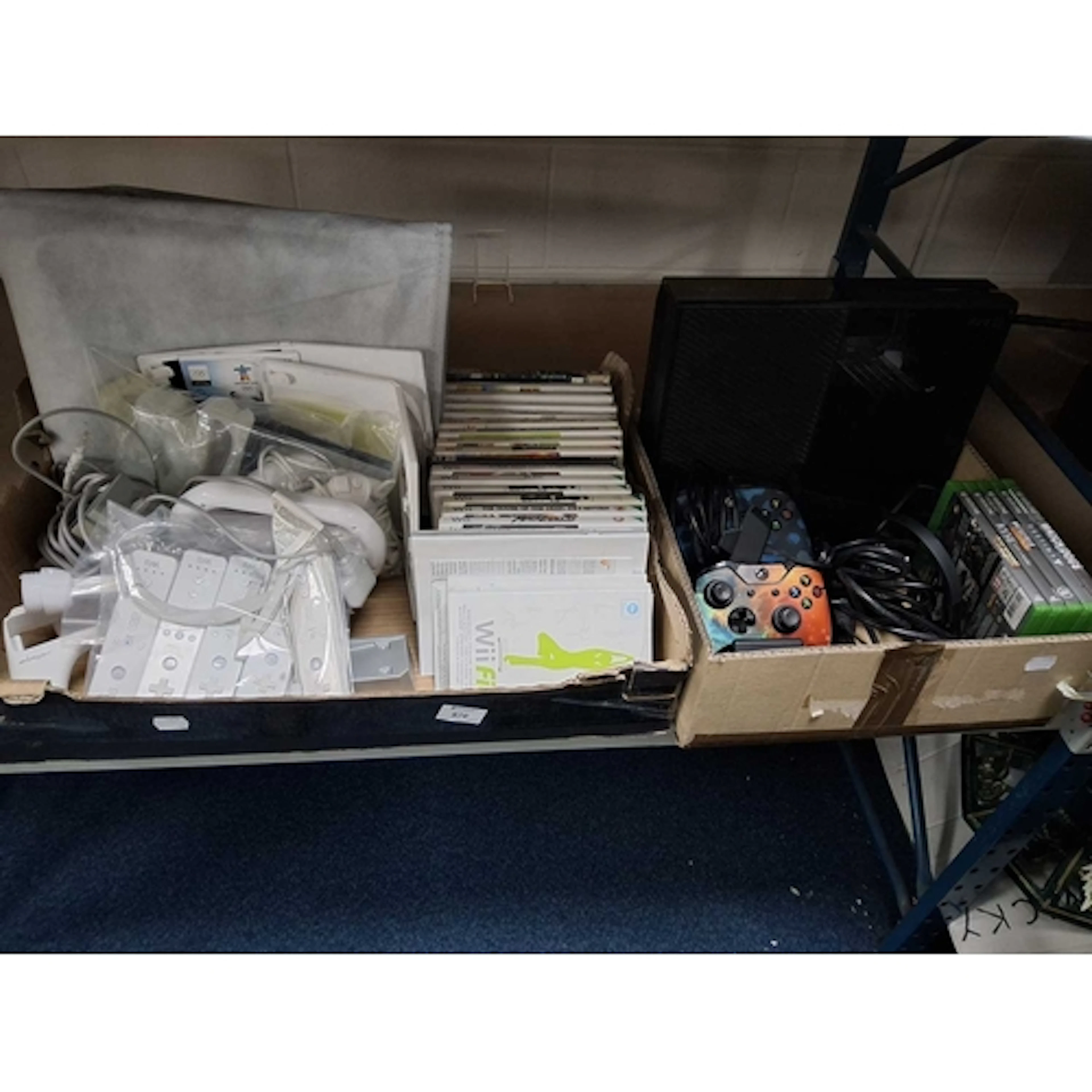 TWO BOXES OF VIDEO GAME RELATED ITEMS includes a box contain...