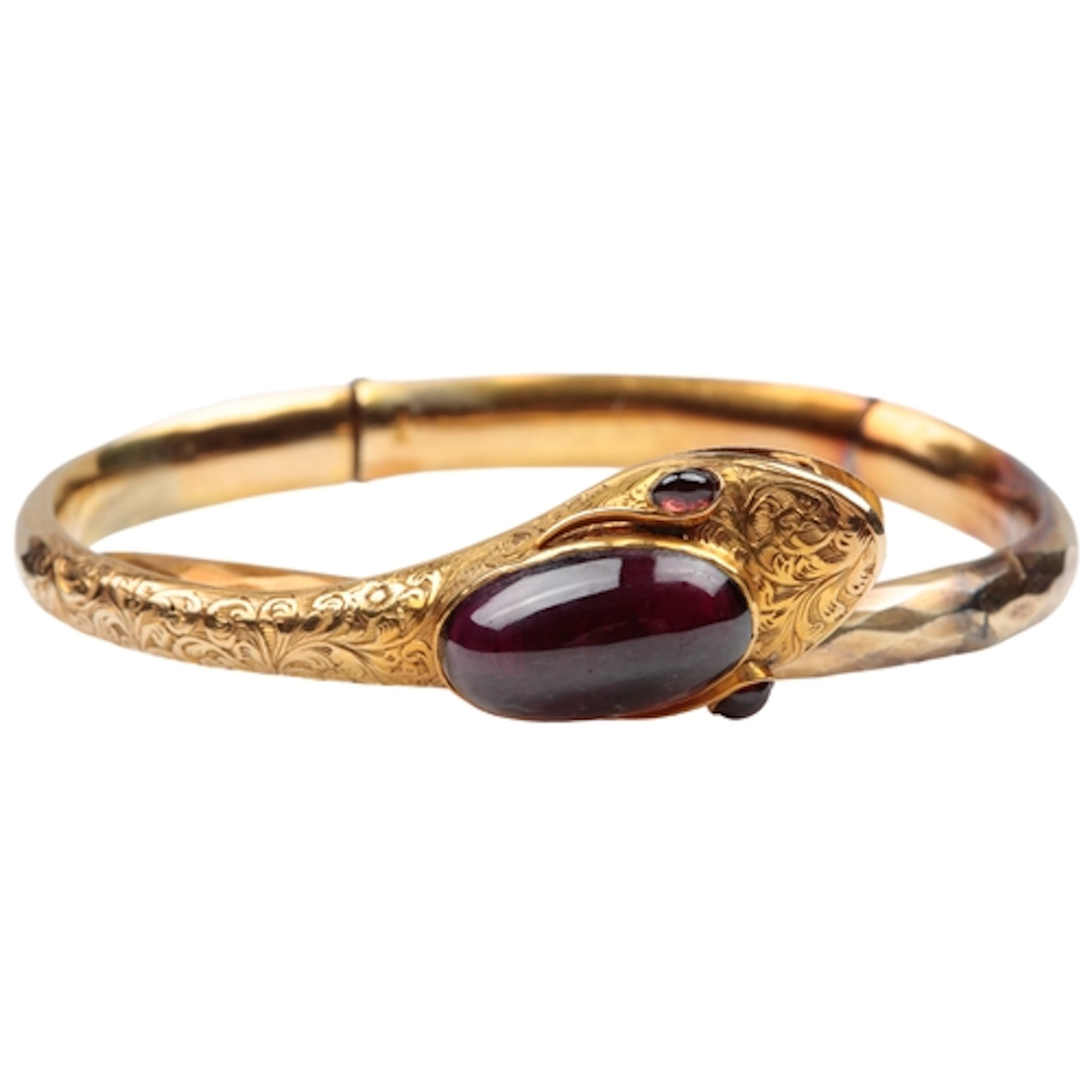 A Victorian gold and garnet snake bangle, mid 19th century, ...
