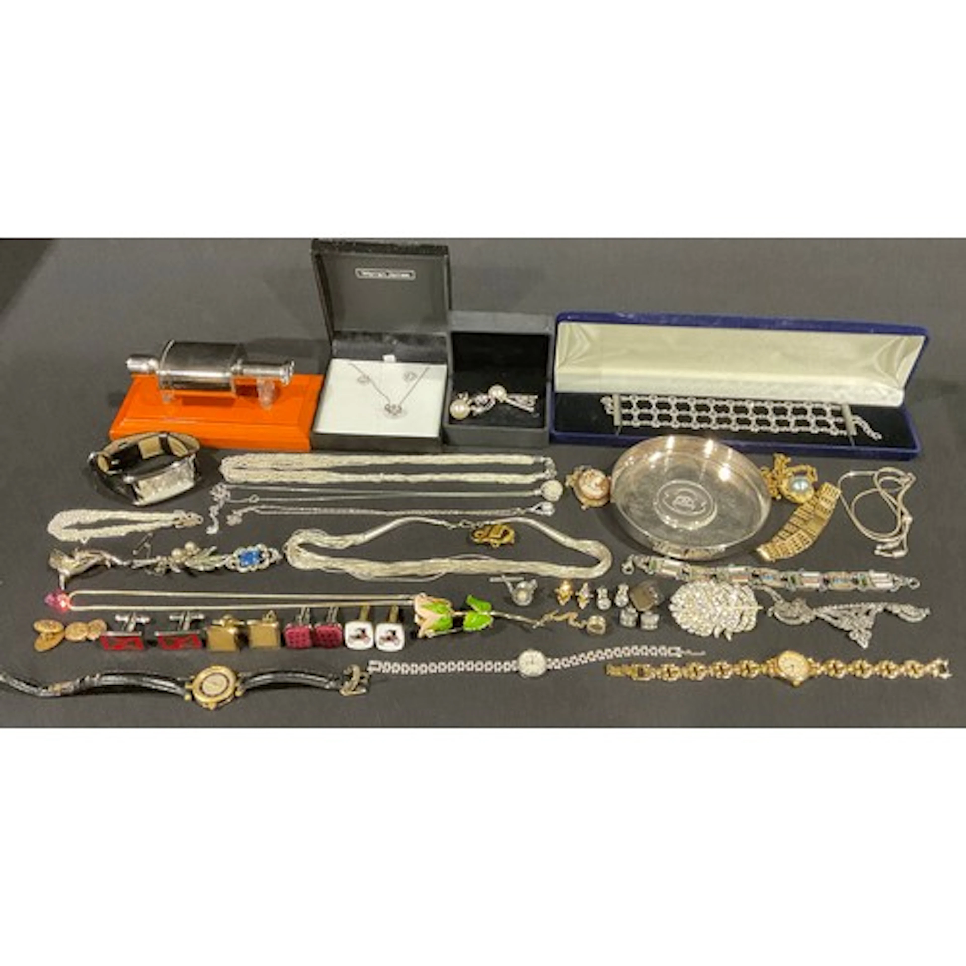 A selection of silver and costume jewellery and watches, the...
