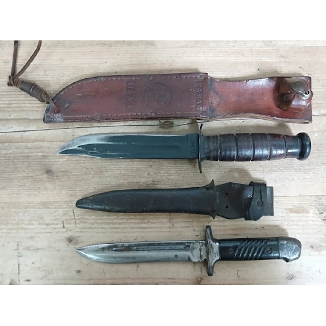 Two knives; USMC KA-BAR fighting knife and a German K98 bayo...
