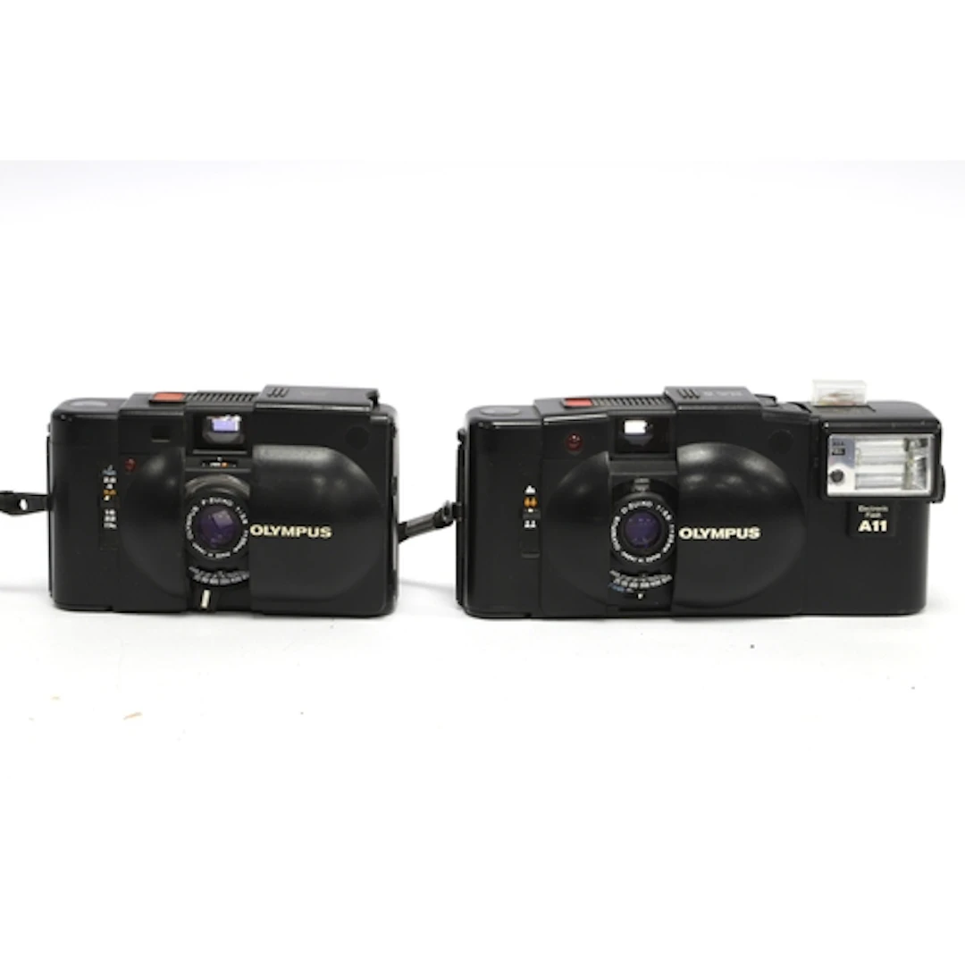 Olympus XA 35mm Compact Film Camera together with a XA2 exam...