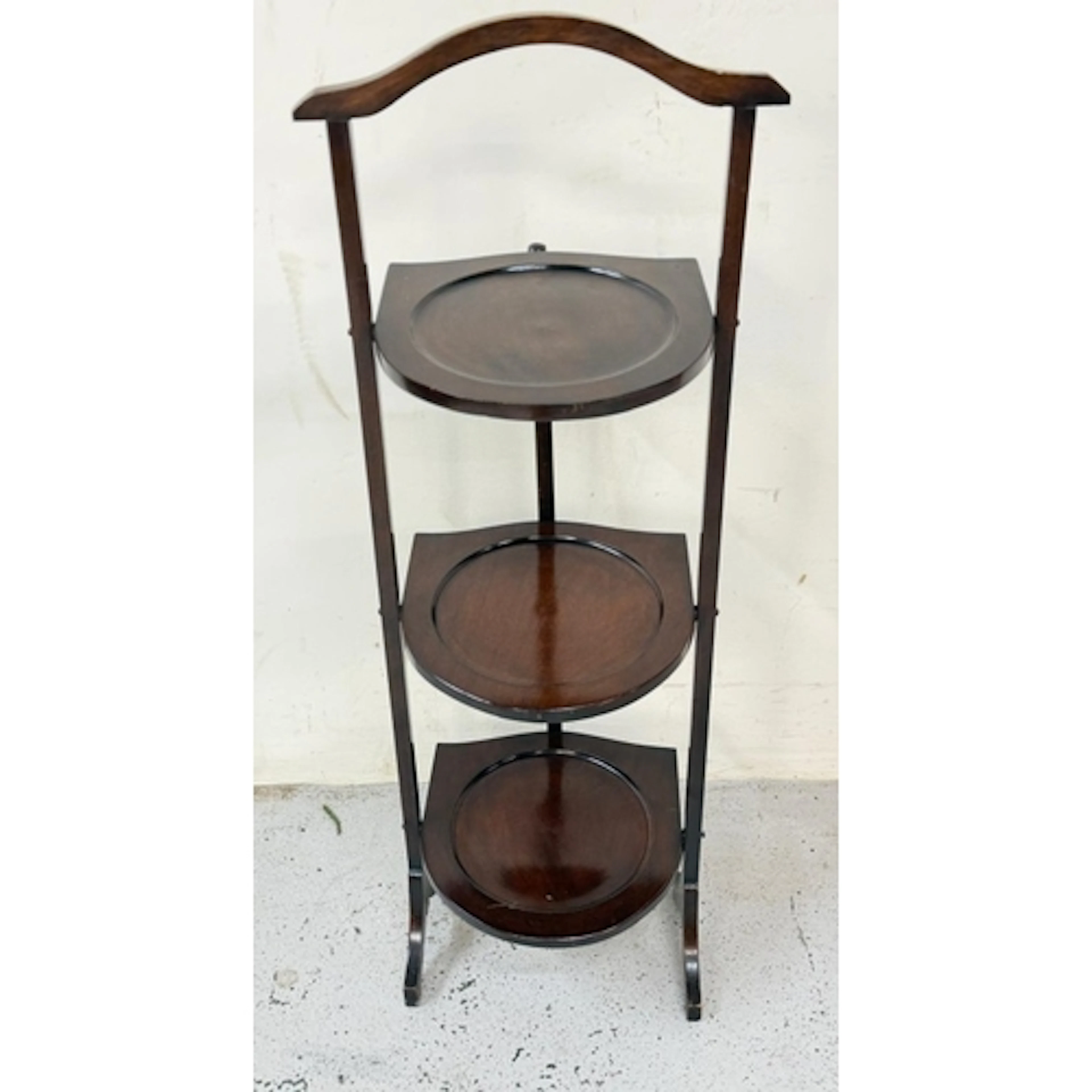 A three tier folding cake stand.