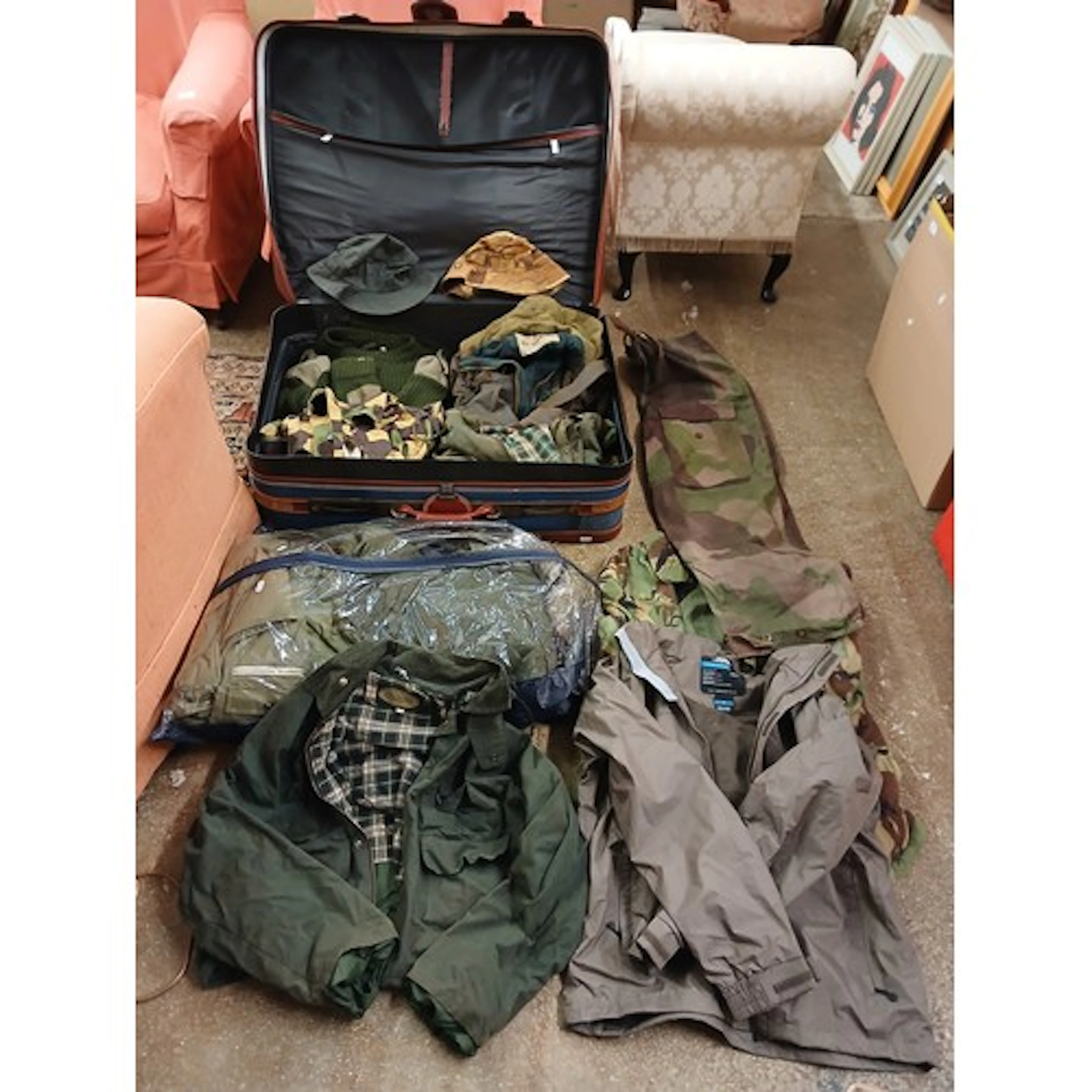 Suitcase and bag containing outdoor gear.