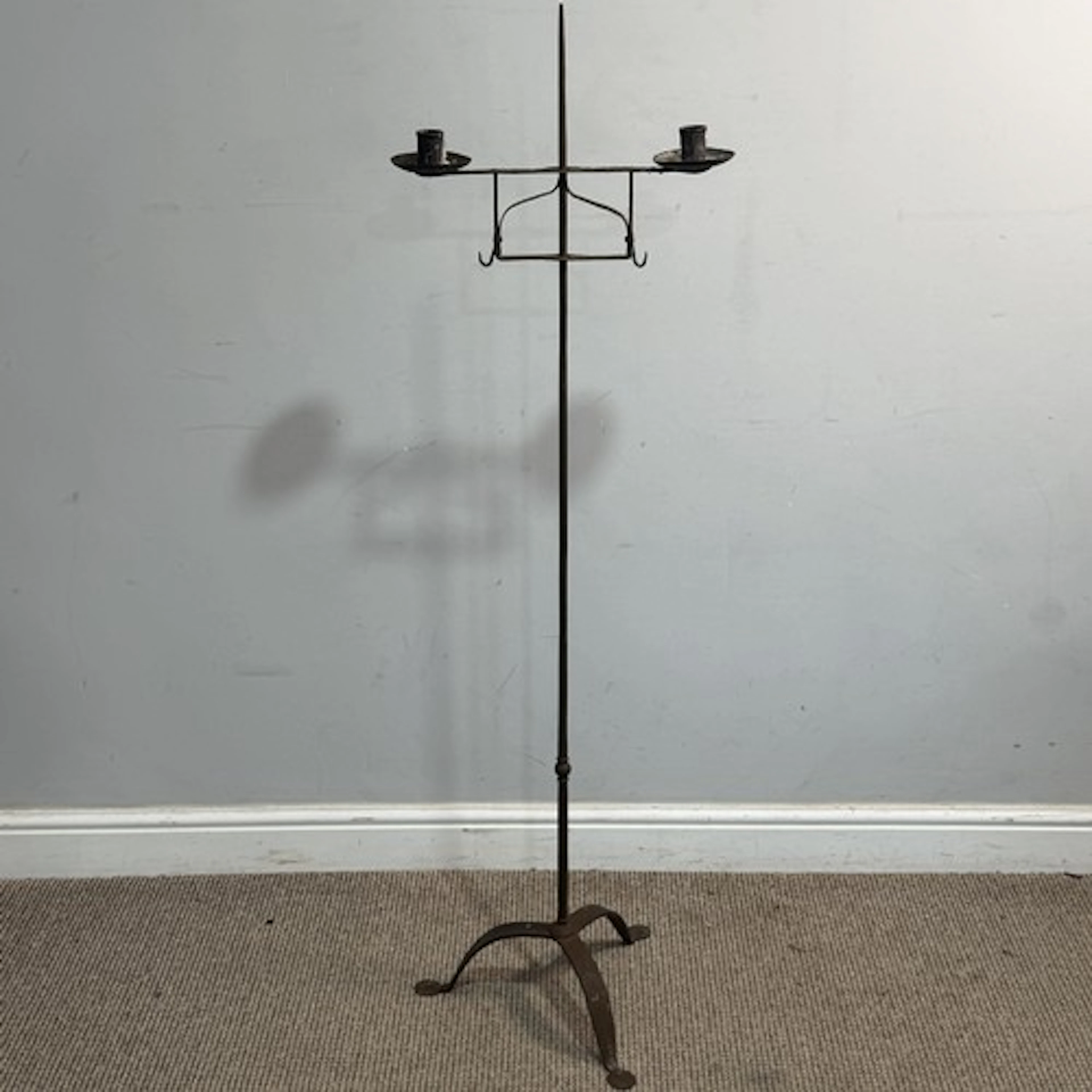 A craftsman-made wrought iron floor standing candle Holder, ...