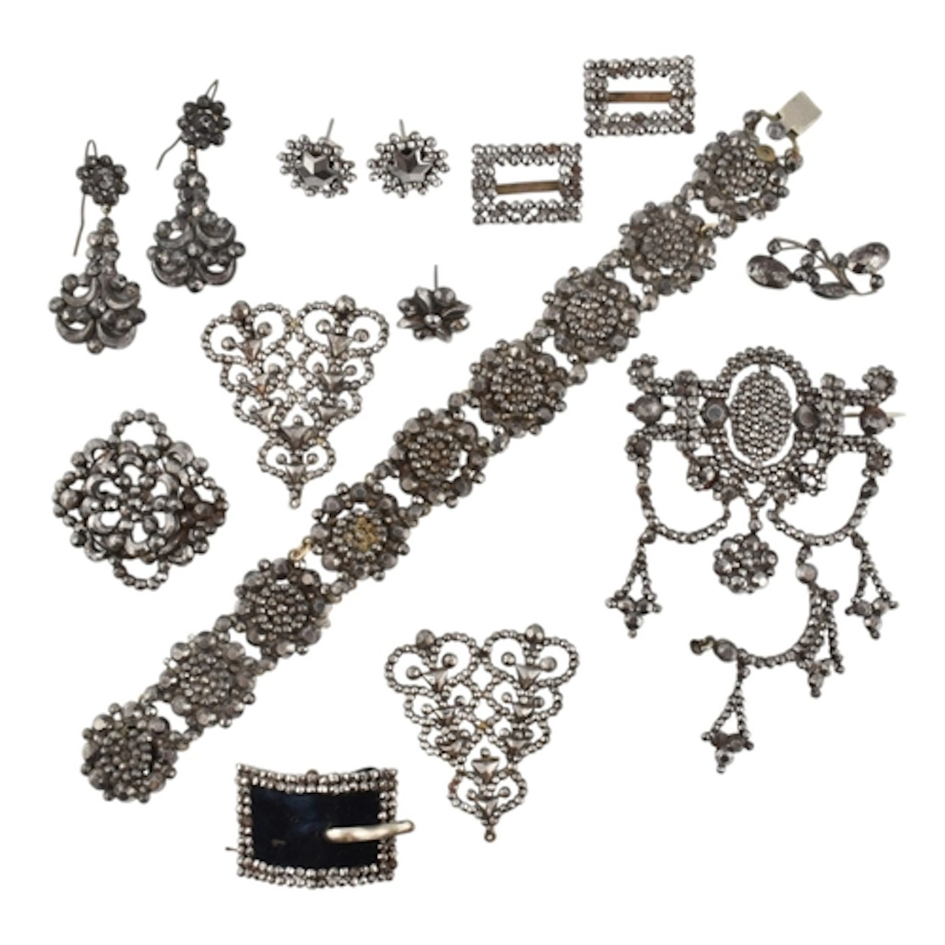 A collection of 19th century cut steel jewellery. The jewell...
