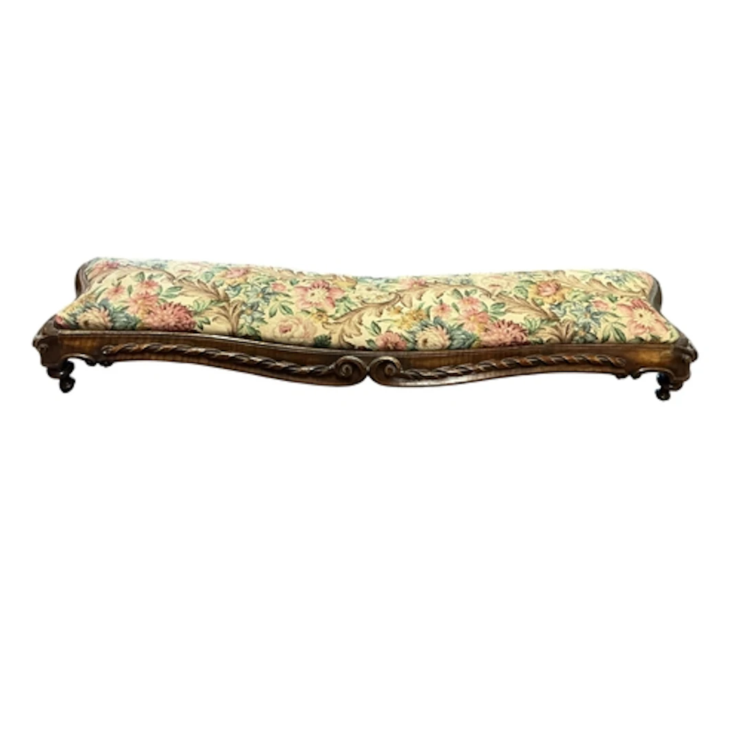 A Victorian carved walnut fender stool, length 113cm, depth ...