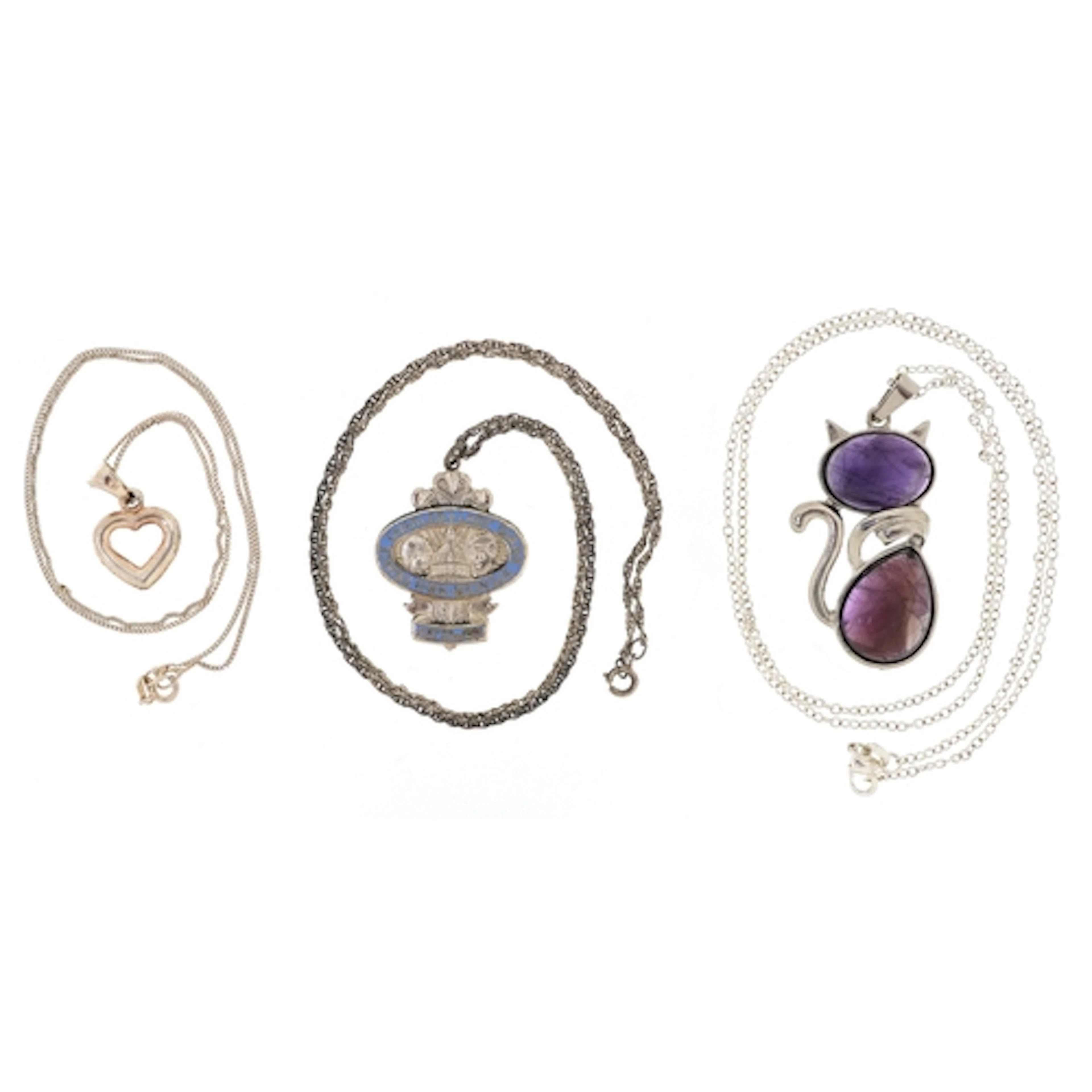 Three silver and white metal pendants on chains including a ...