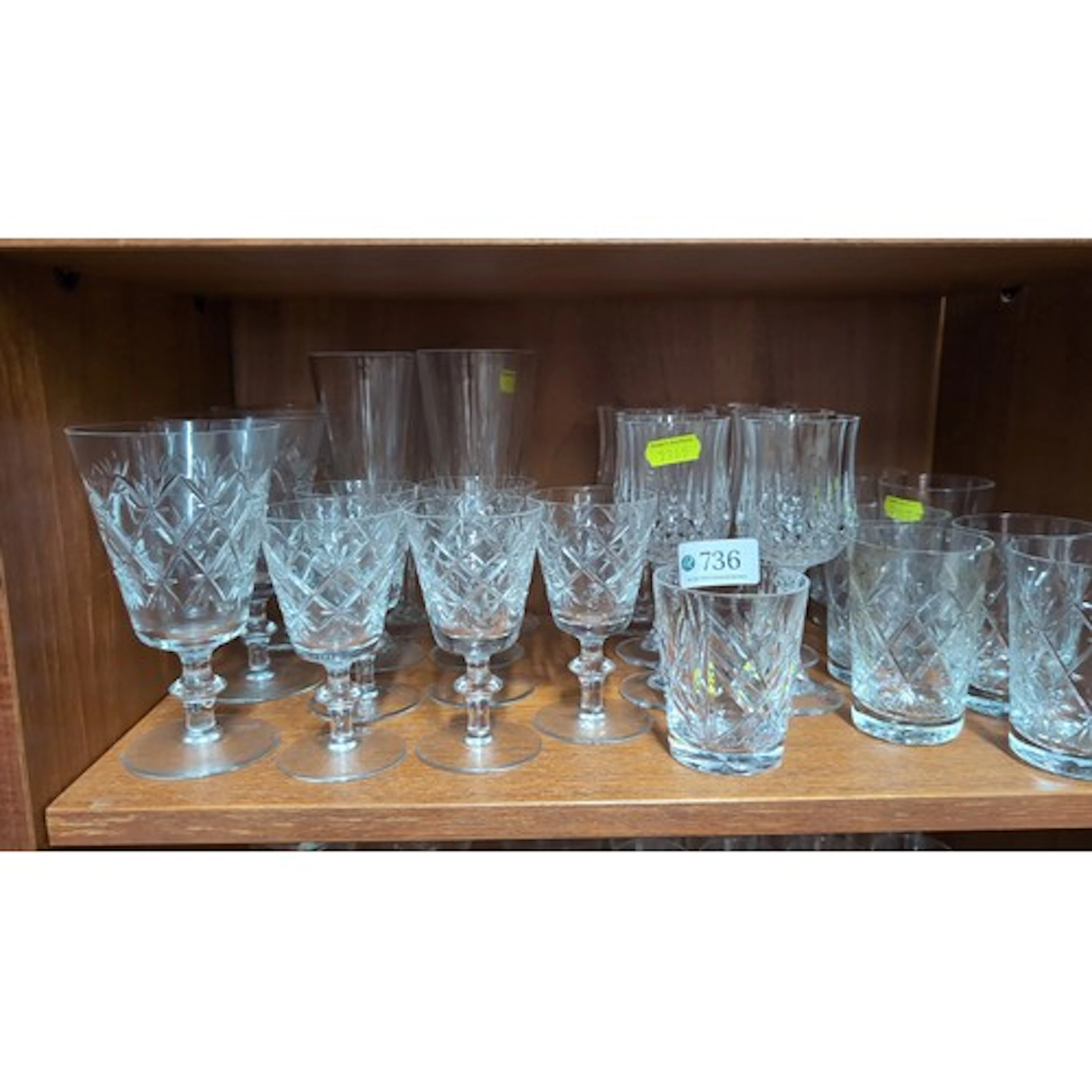 A collection of cut glass table wares, including star-cut go...