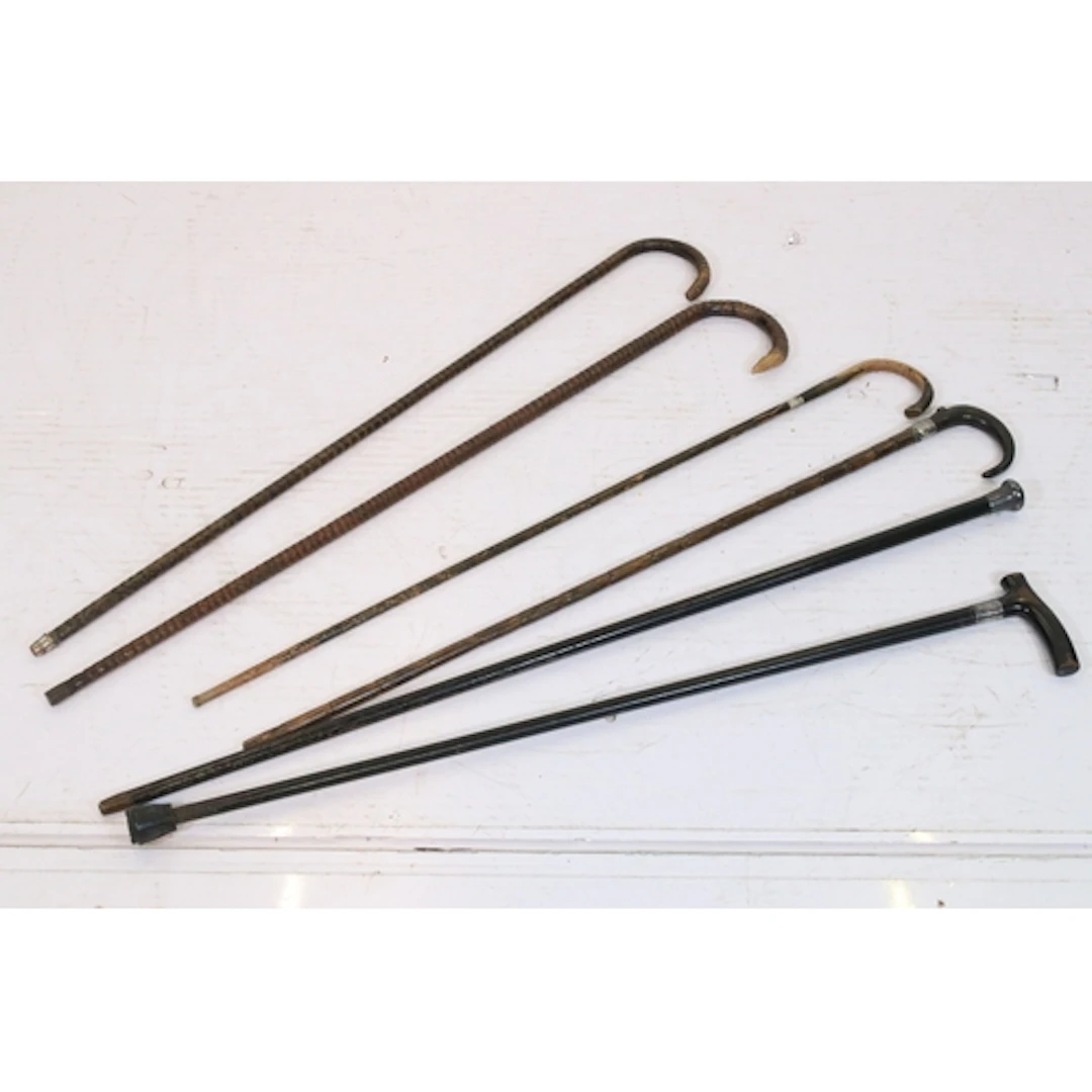 Group of six antique walking sticks, to comprise one with ha...