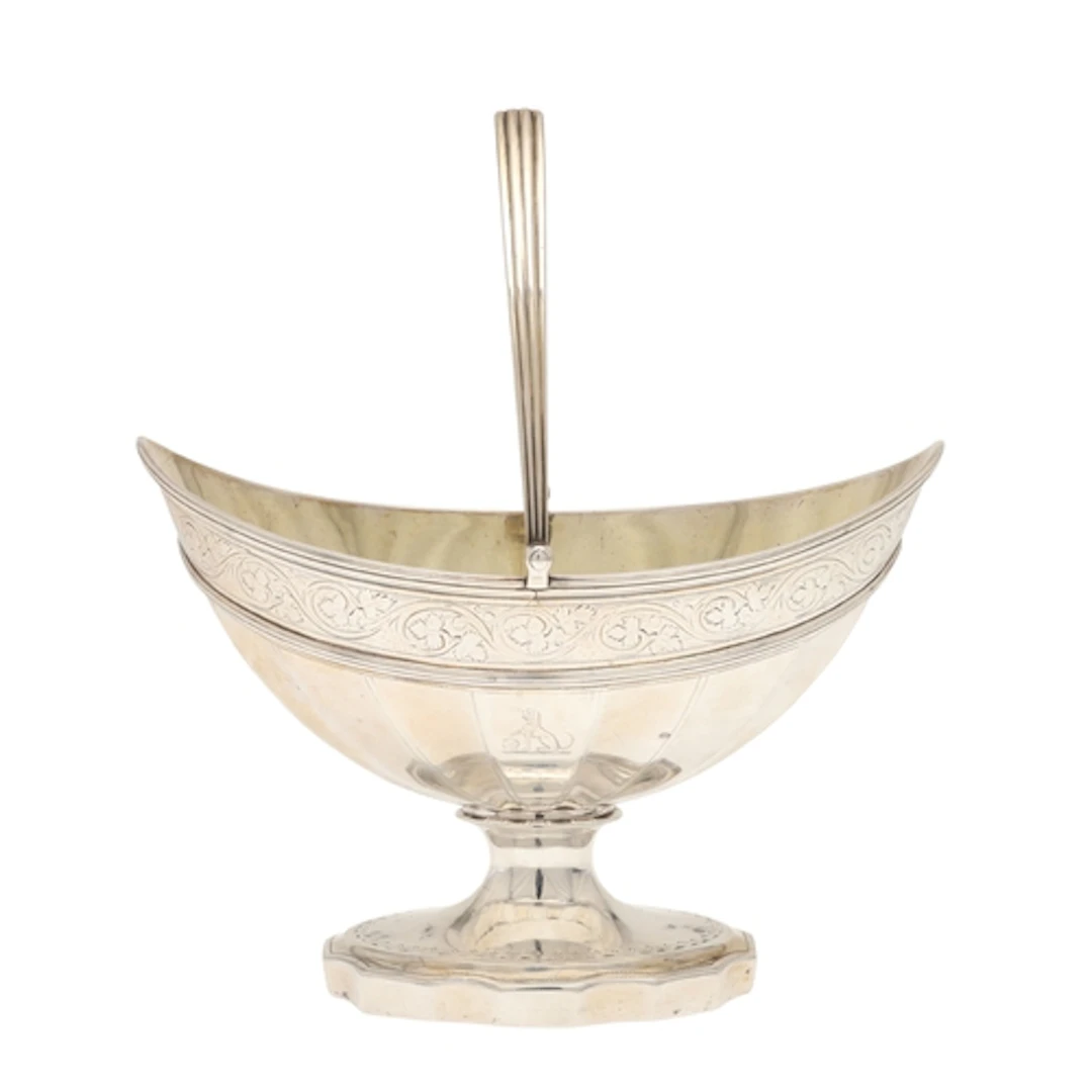 A GEORGE III SILVER SWING HANDLED PEDESTAL BOWL. The bowl of...