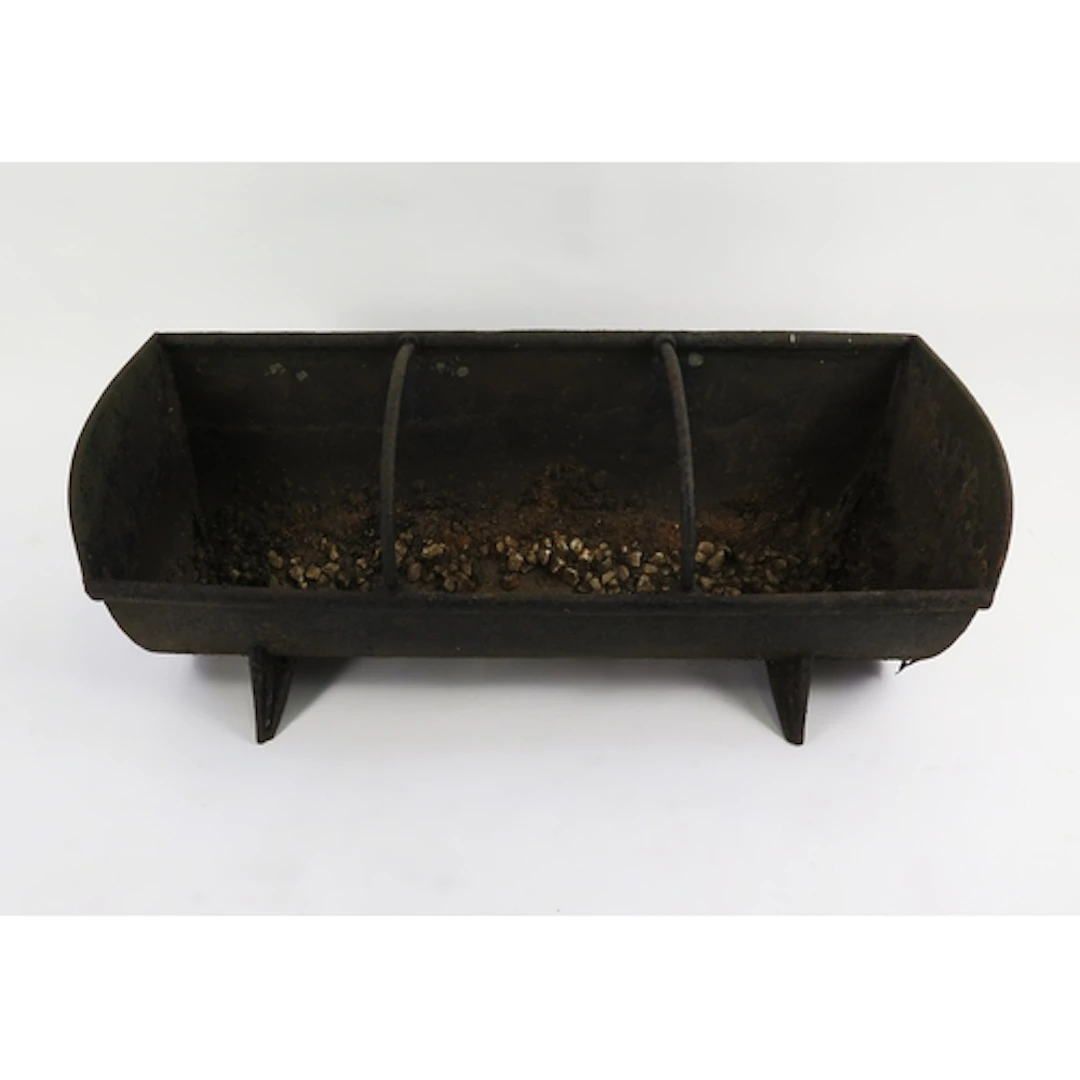 A three division cast iron feeding trough, raised on splayed...