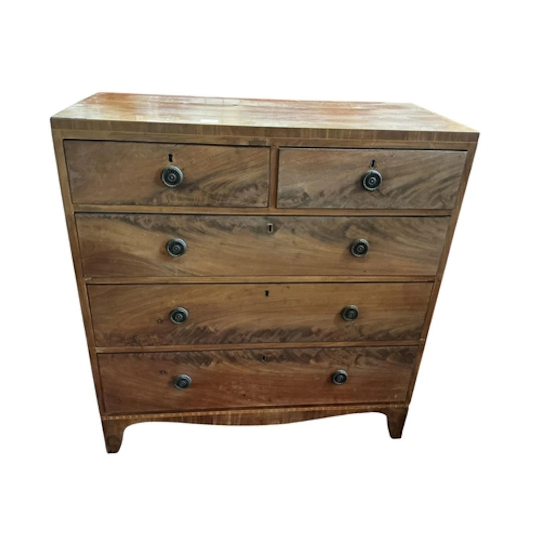 A Regency mahogany chest of drawers, two short over three lo...