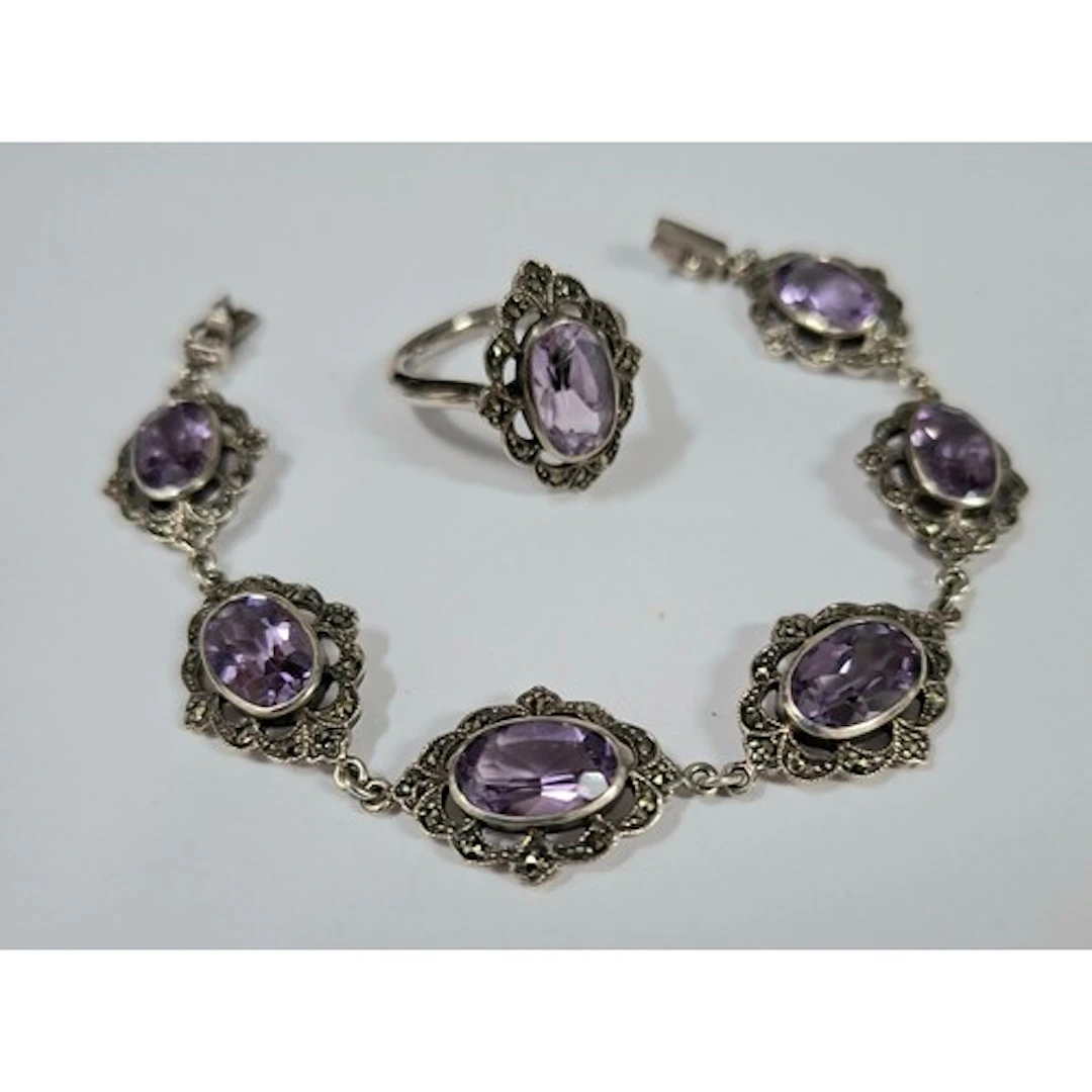 A silver, marcasite and amethyst stone bracelet together wit...