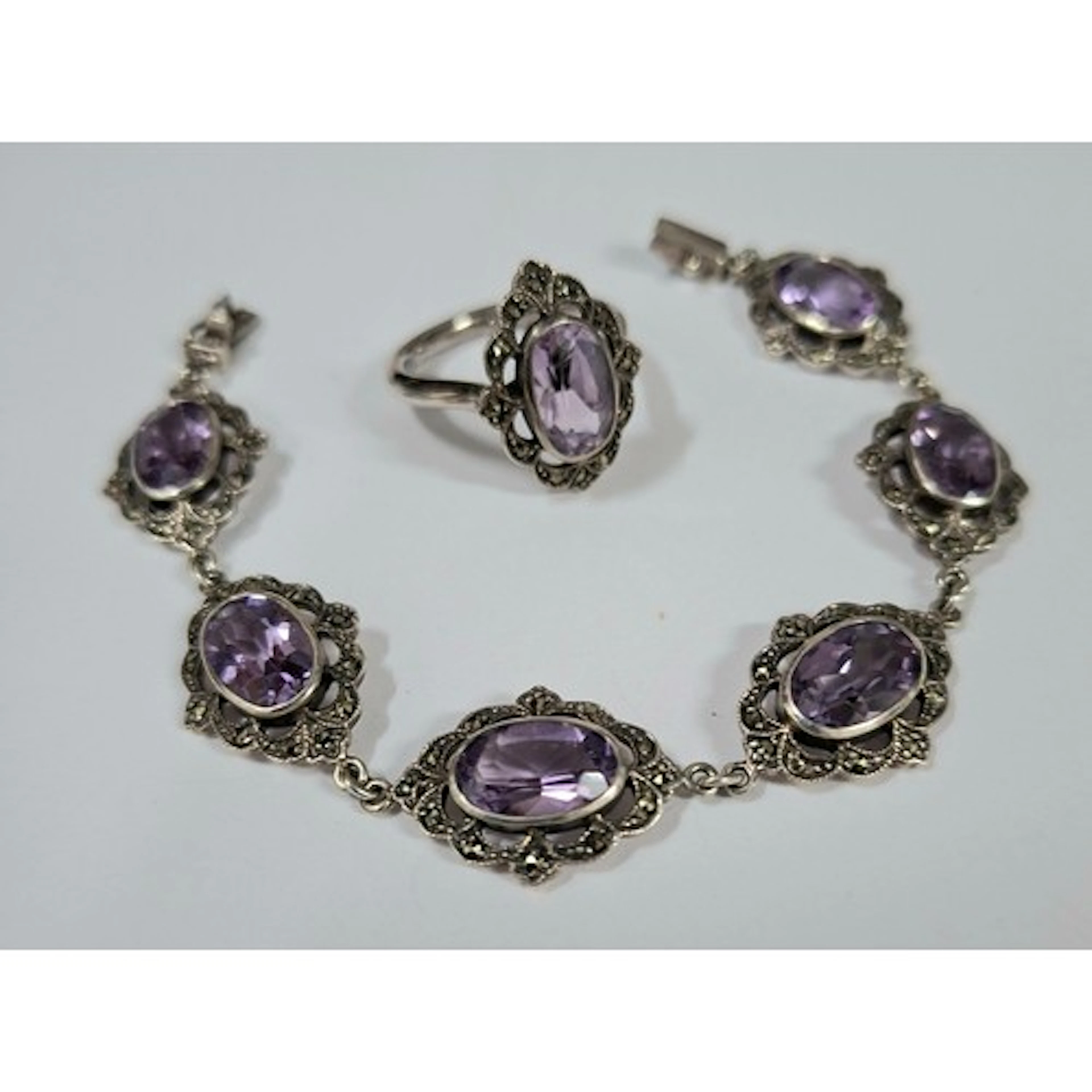 A silver, marcasite and amethyst stone bracelet together wit...
