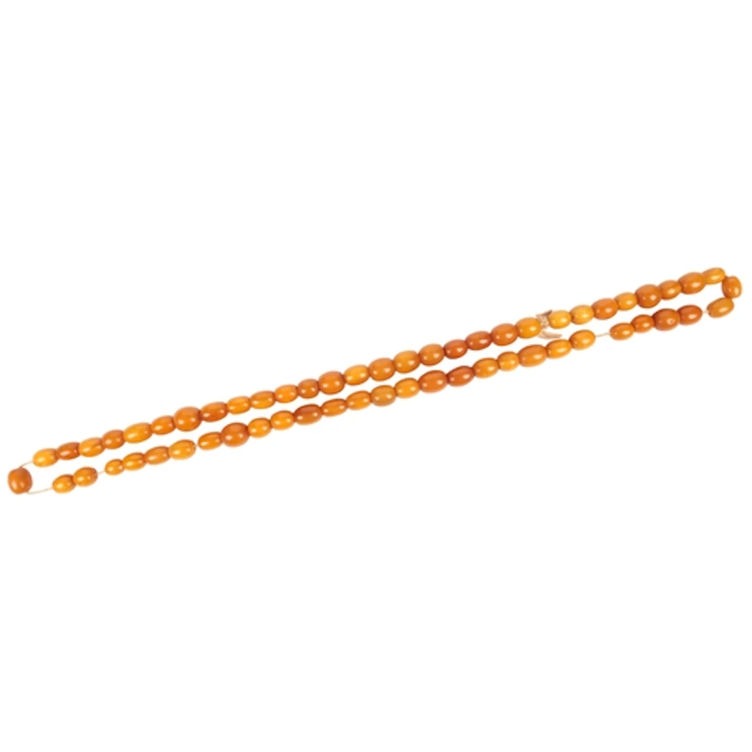 An amber bead necklace, composed of oval amber beads measuri...