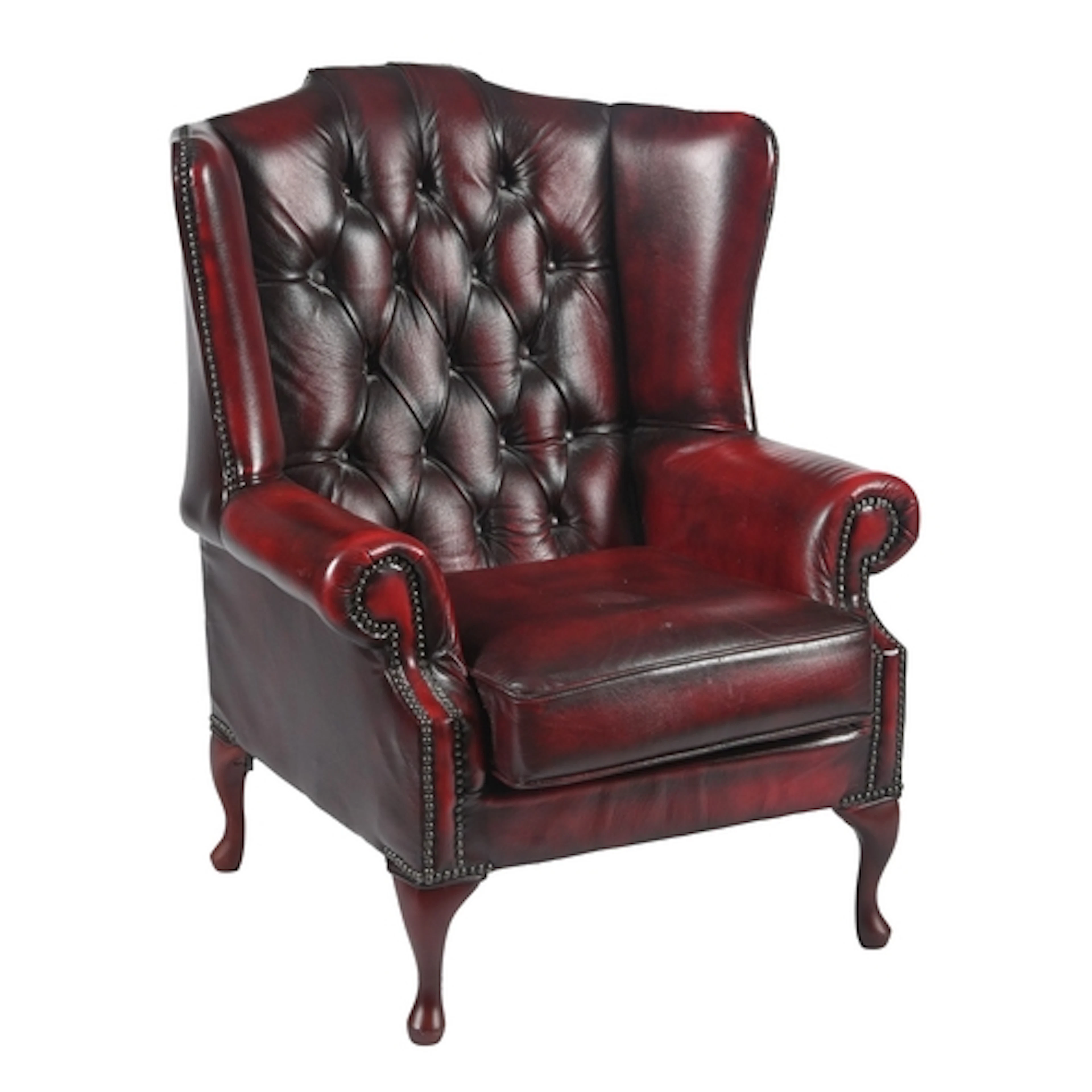 An antique style wingback armchair, late 20th c, covered in ...