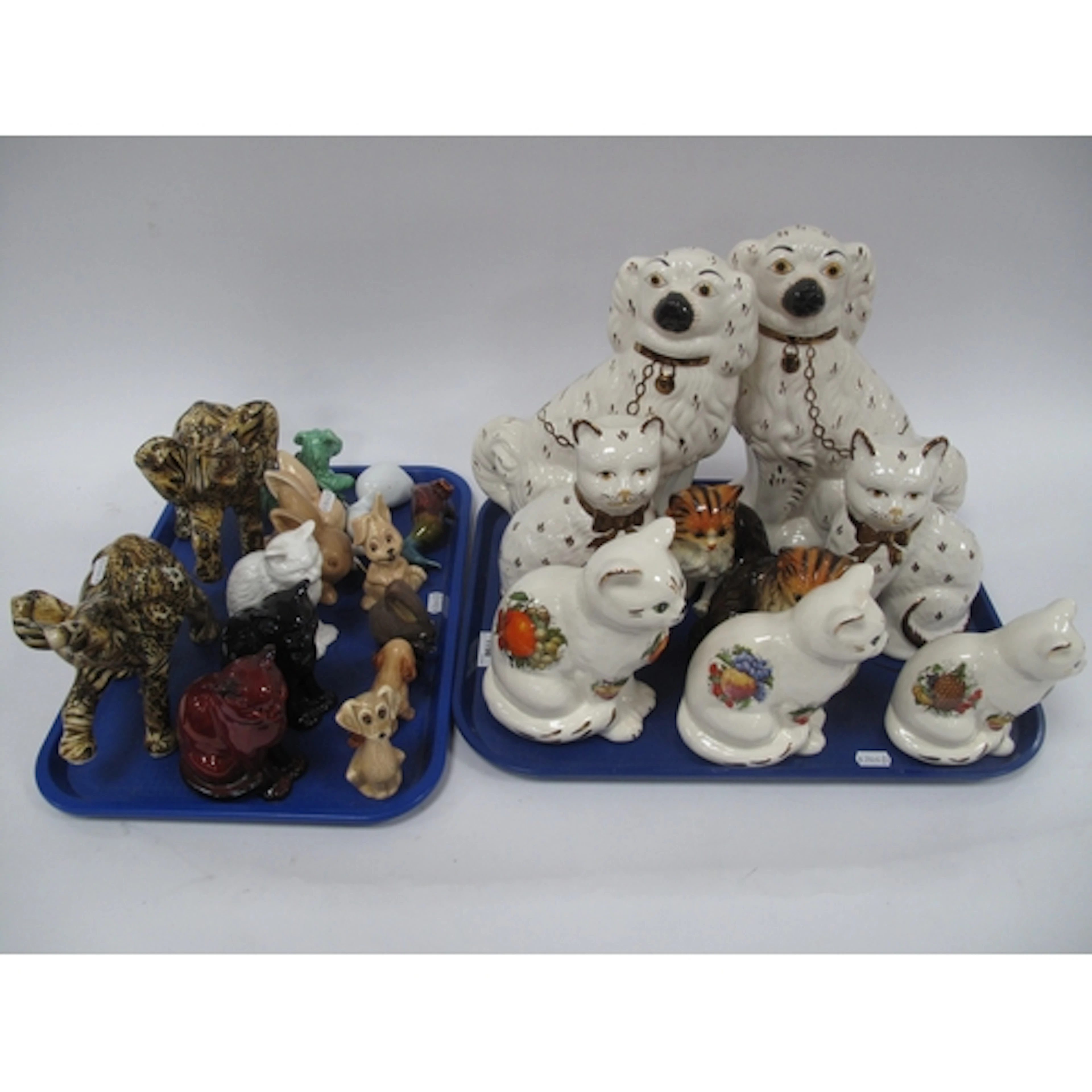 Ceramic and porcelain animal figures, including a pair of St...
