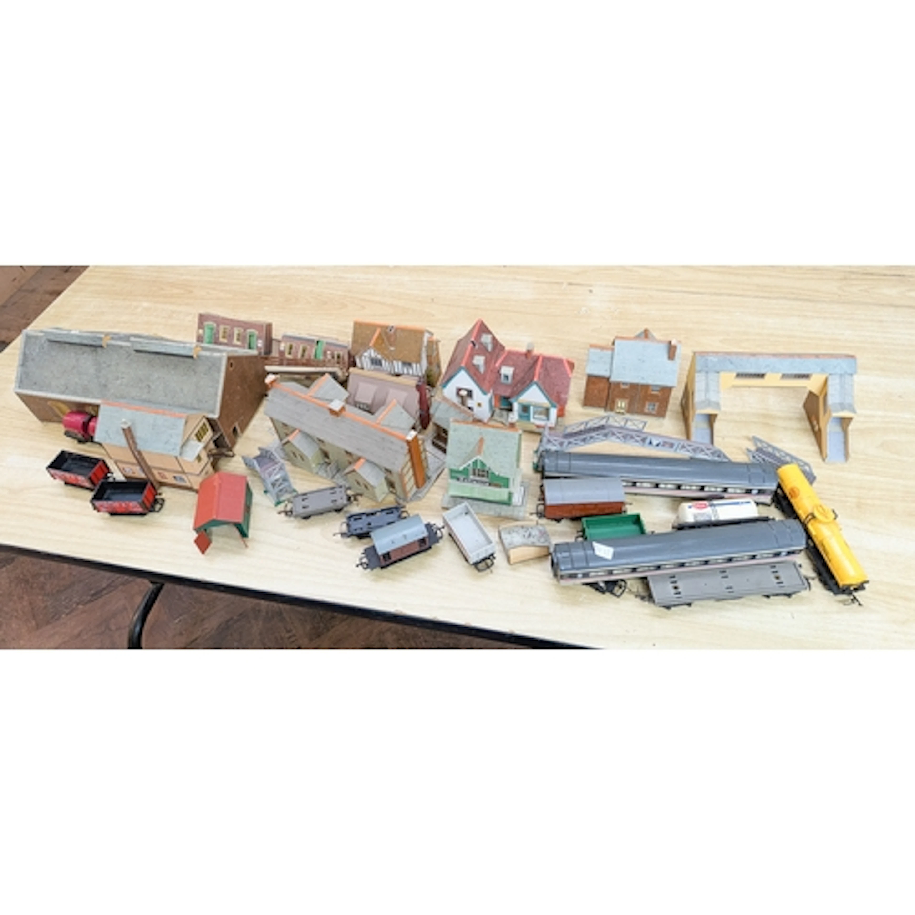 A quantity of model train carriages and buildings