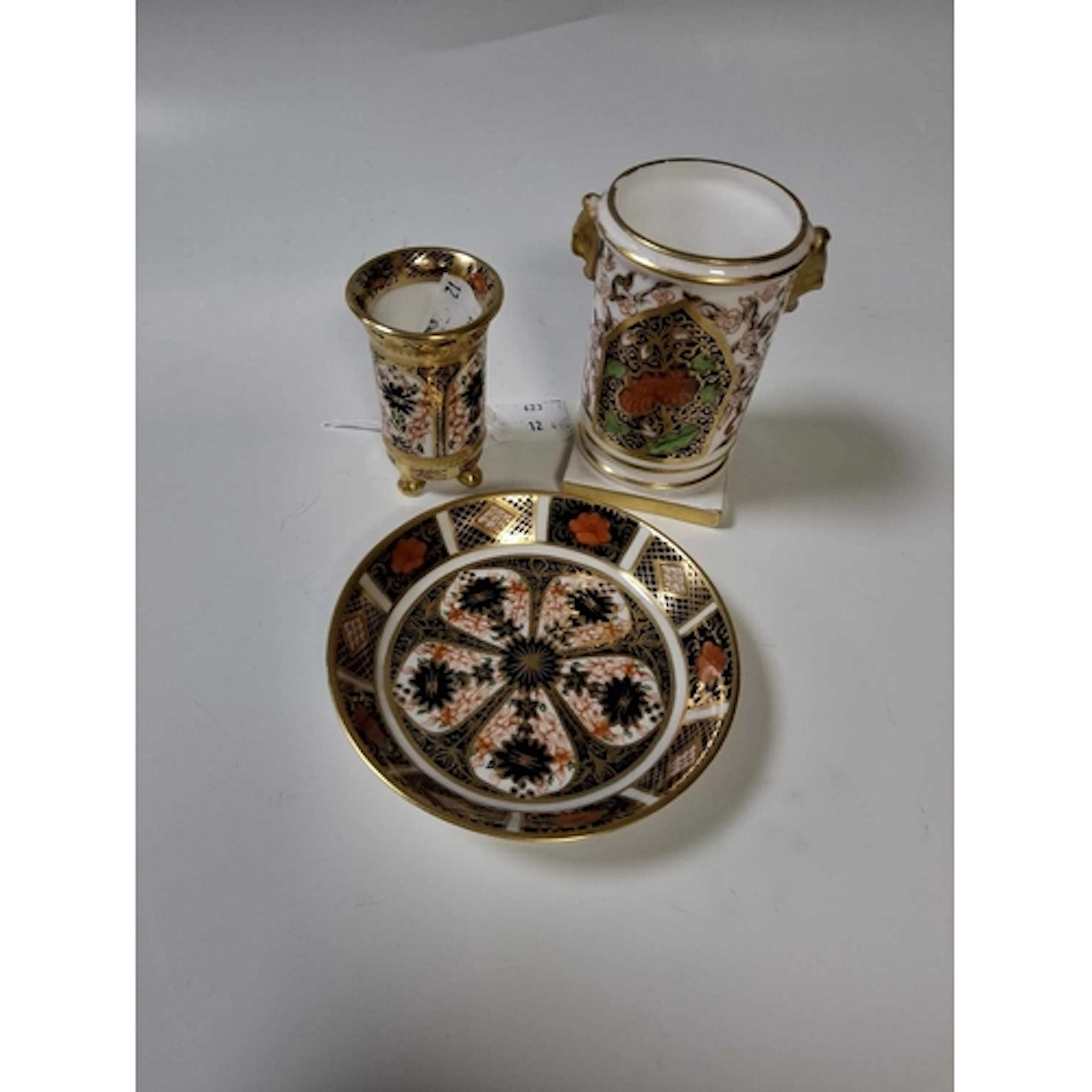 THREE PIECES OF ROYAL CROWN DERBY comprising a circular pin ...