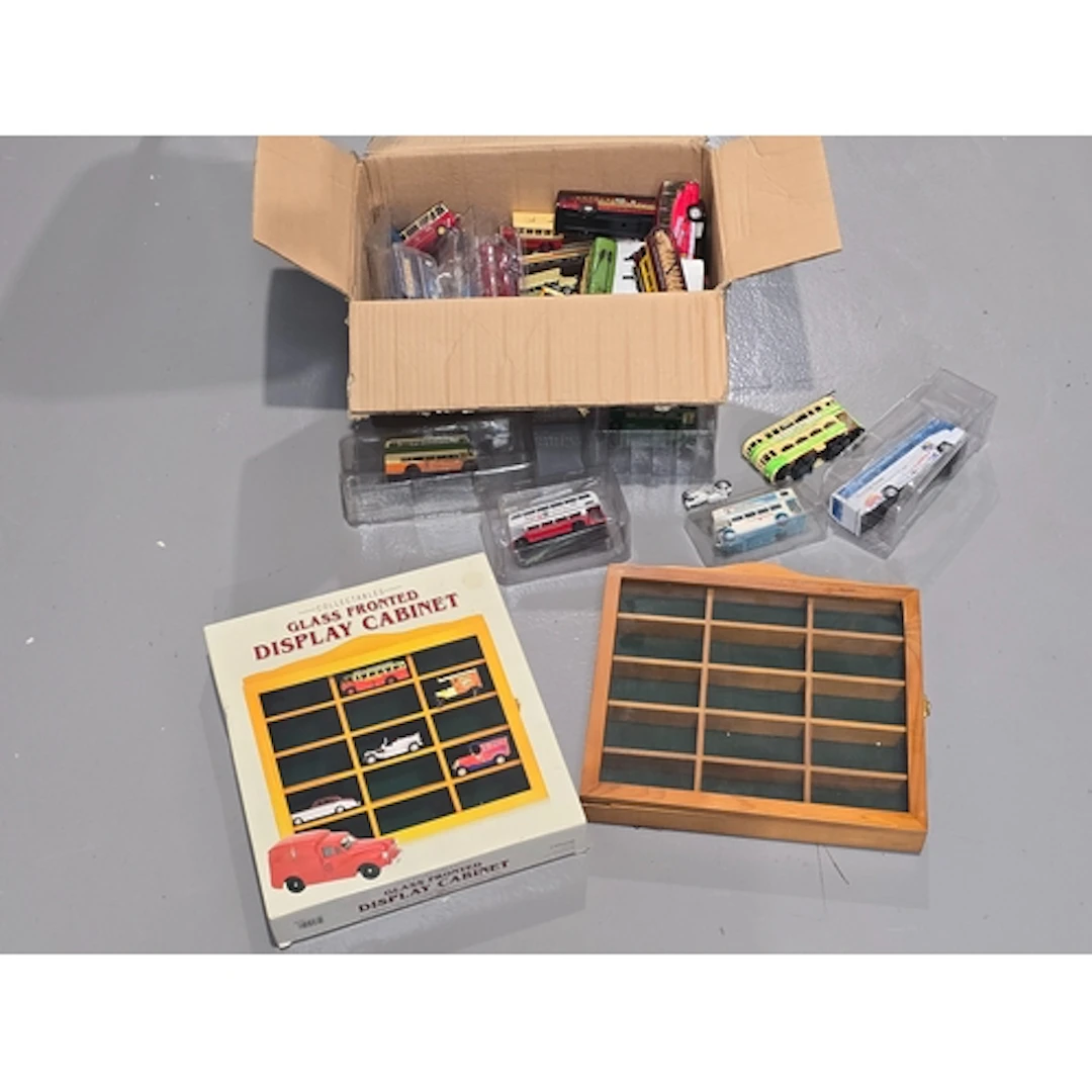 A collection of unboxed die cast models together with two gl...
