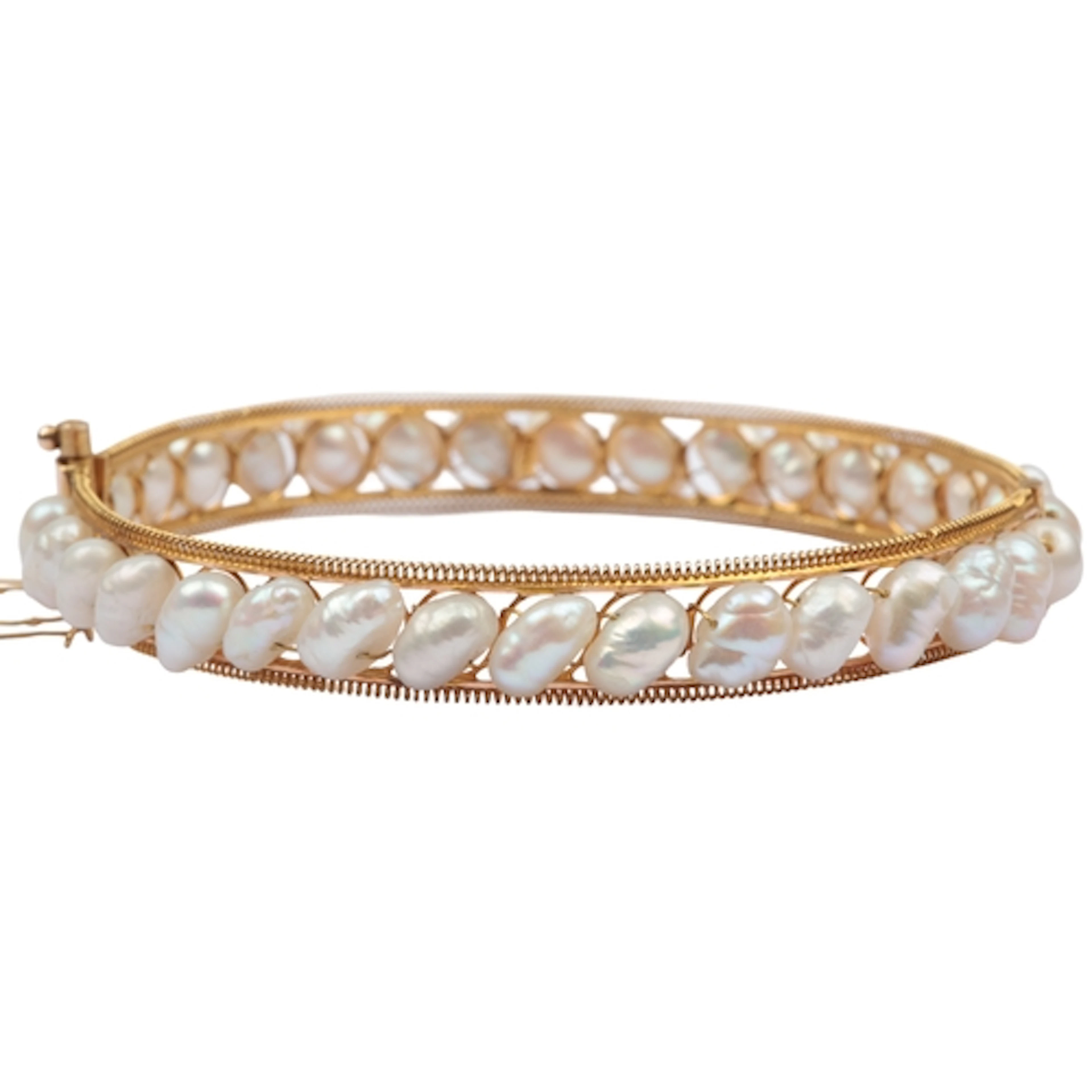 A cultured pearl bangle, the hinged gold bangle centring on ...