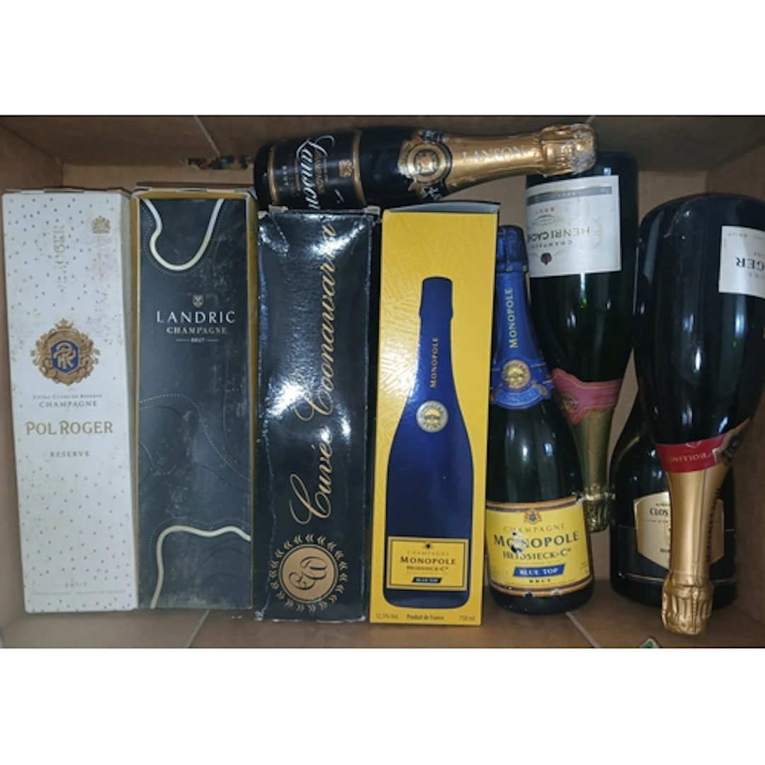 Nine bottles of assorted sparkling wine.