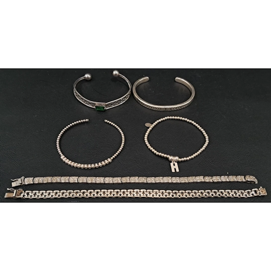 THREE SILVER BANGLES AND TWO SILVER BRACELETS total weight a...
