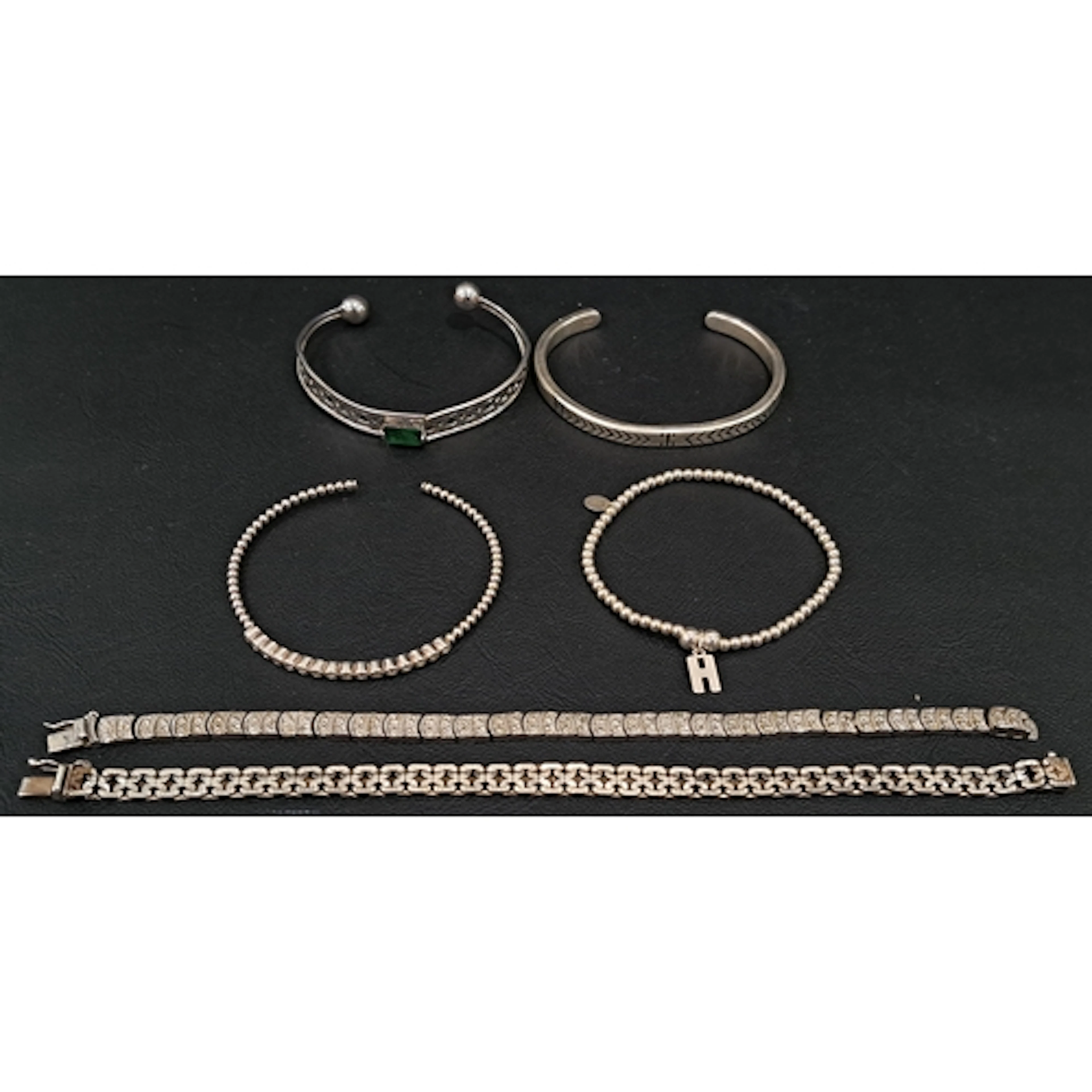THREE SILVER BANGLES AND TWO SILVER BRACELETS total weight a...