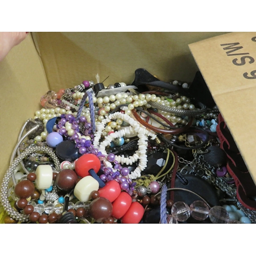 Six boxes containing a quantity of various costume jewellery