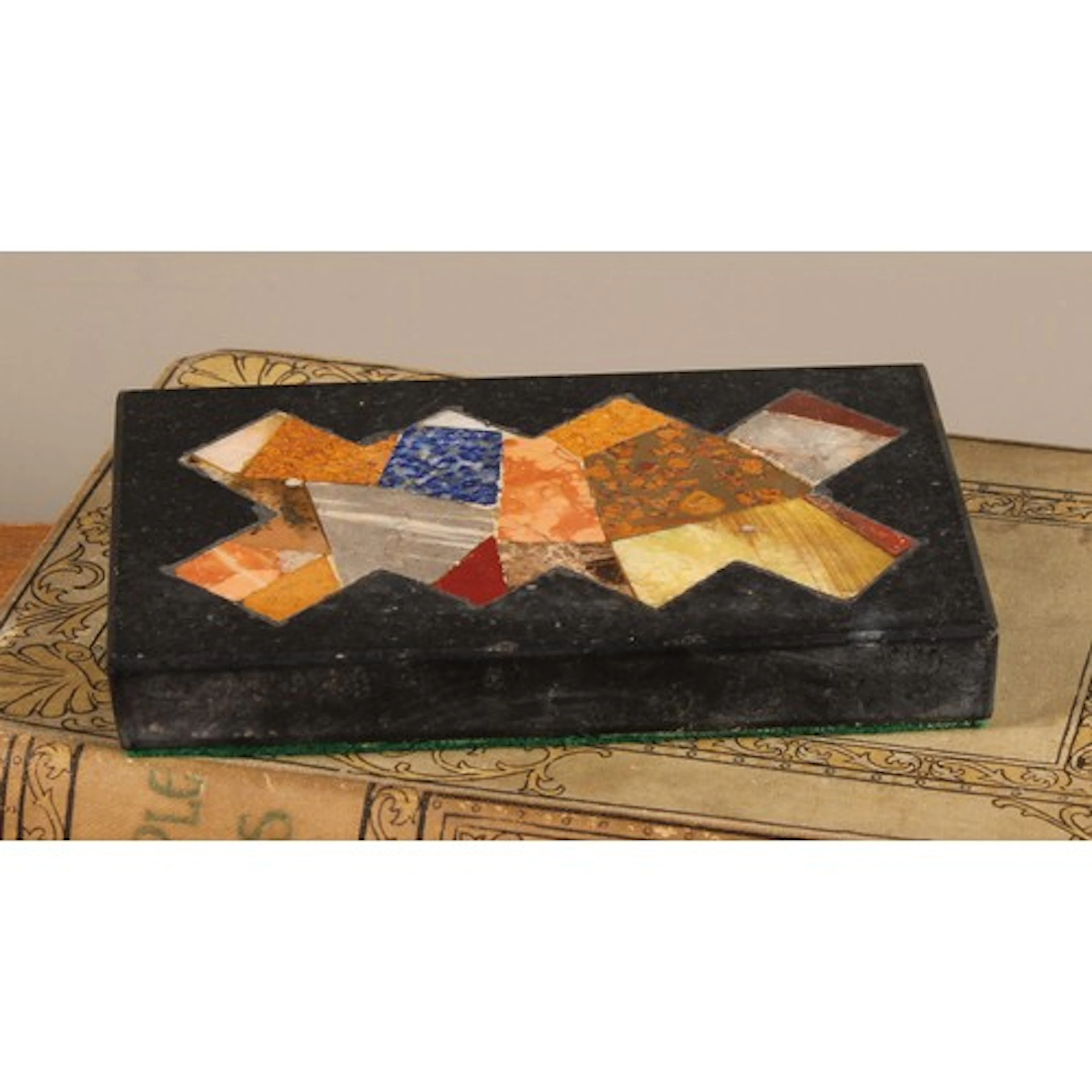 A Pietra Dura rectangular desk weight, inlaid with a field o...