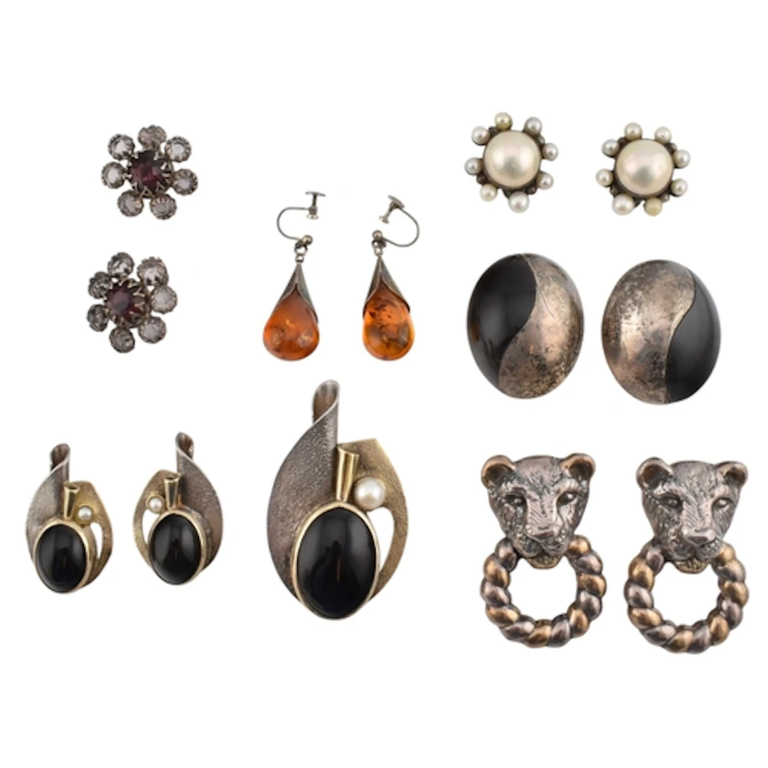A collection of clip-on and screw-back earrings. Six pairs o...