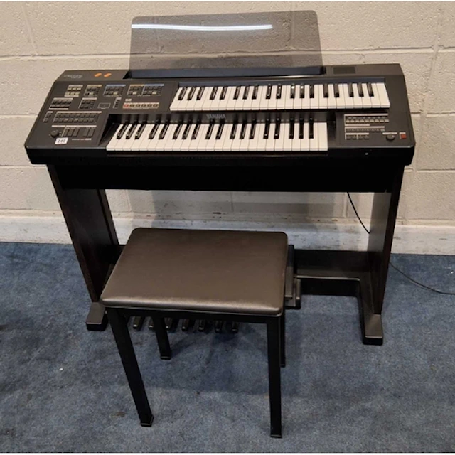 A YAMAHA ELECTONE HC-2 ELECTRONIC ORGAN, along with a stool ...