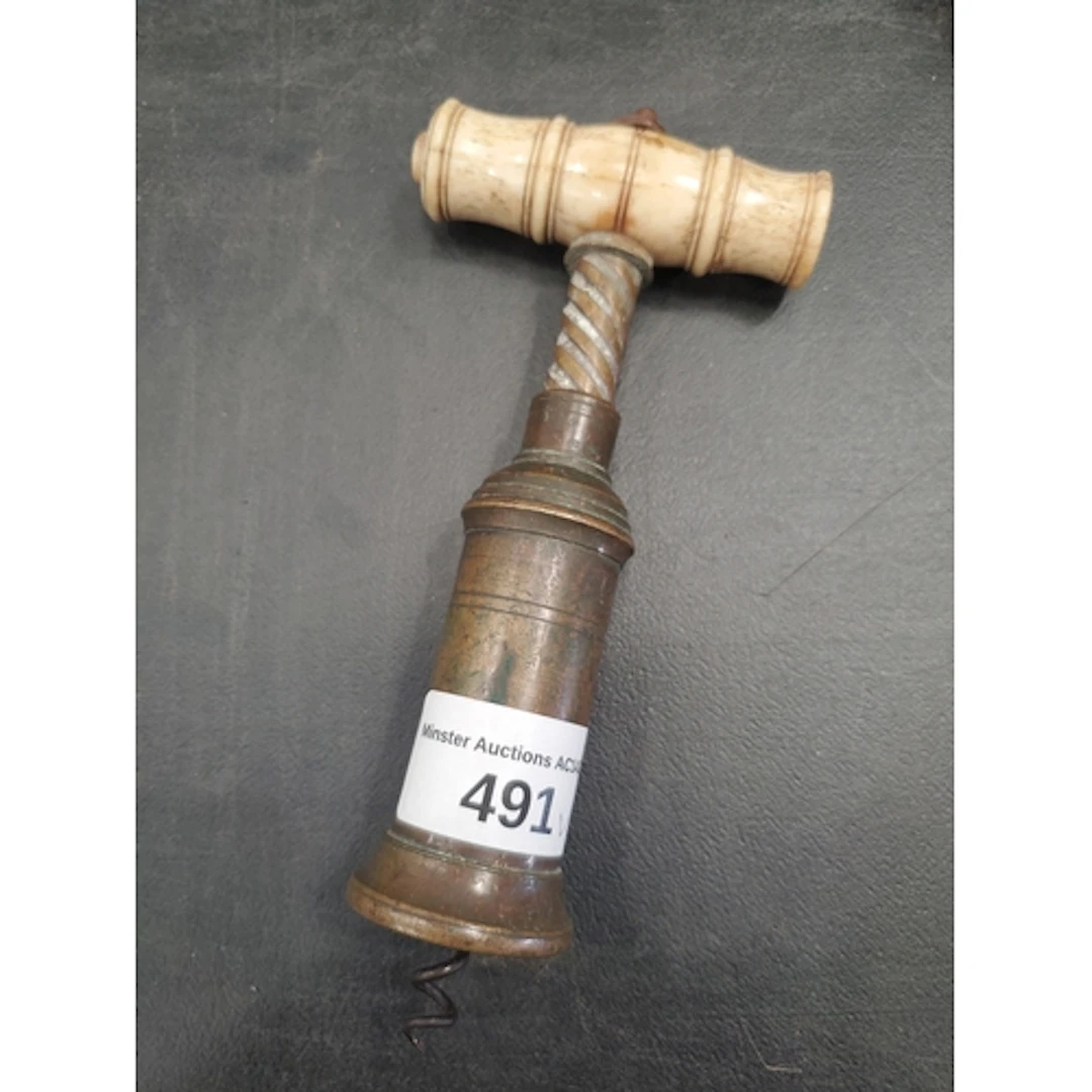 An antique bone handled Corkscrew with embossed crest (R5)