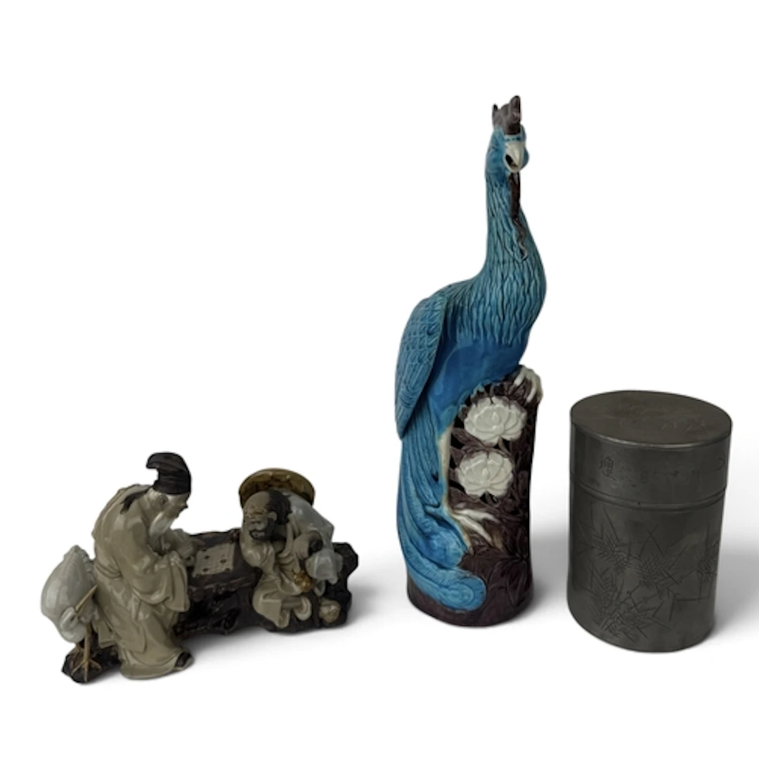 A CHINESE BLUE GLAZE FIGURE OF A FABULOUS BIRD On a naturali...