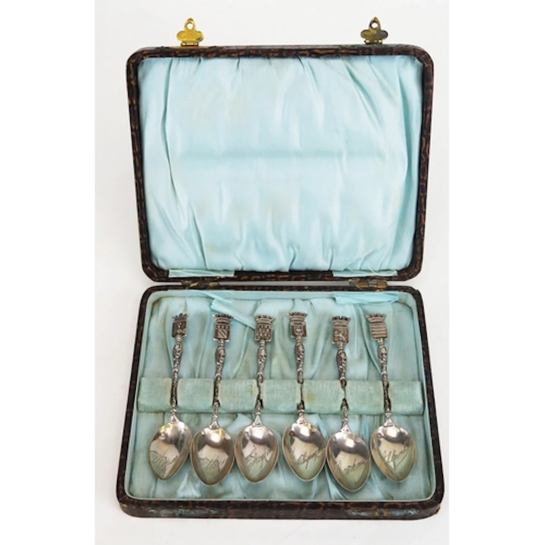 A French set of silver souvenir armorial spoons, stamped for...