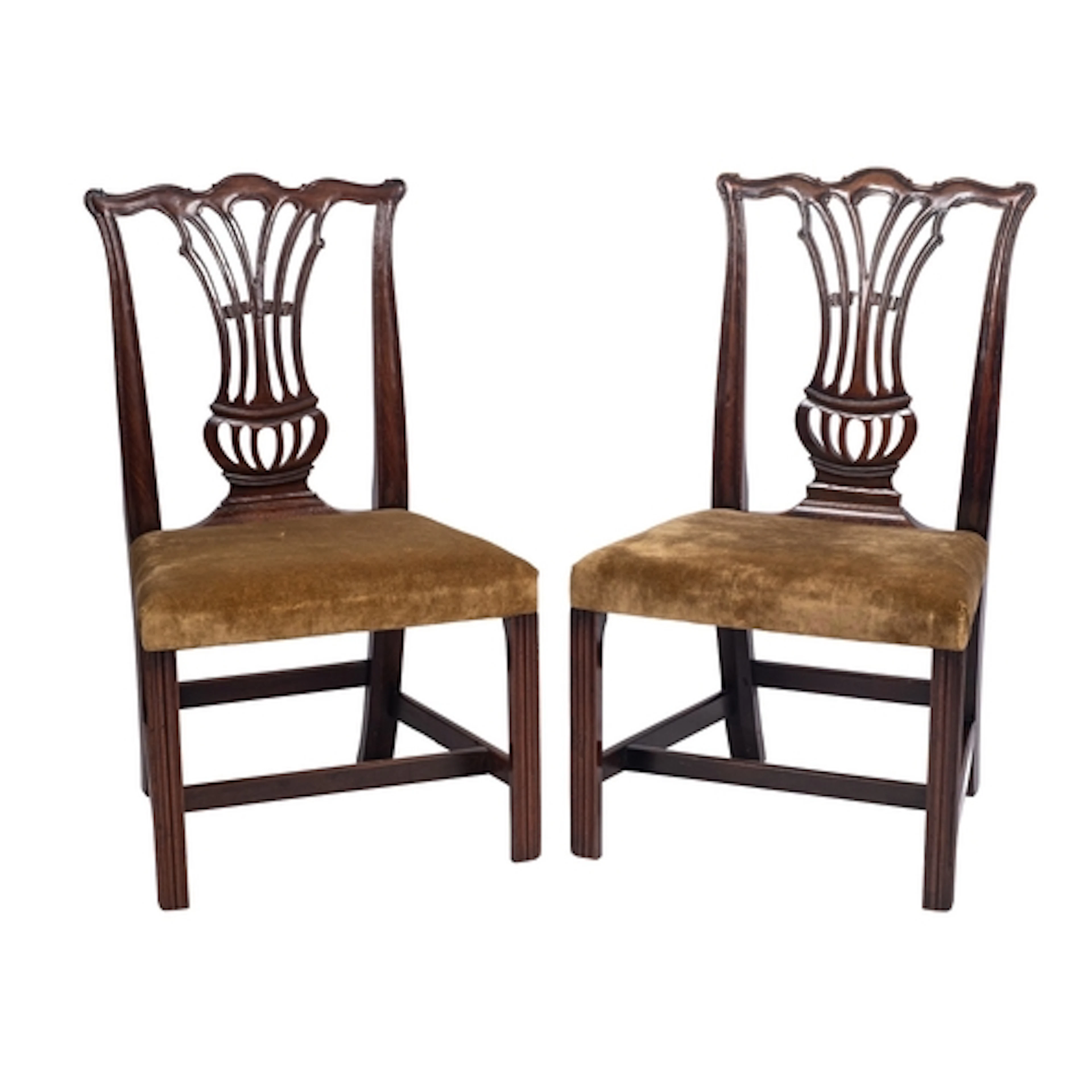 A pair of George III mahogany side chairs, circa 1775; the o...