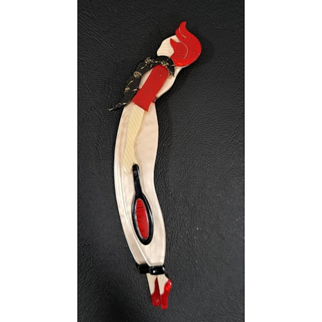 LEA STEIN TENNIS PLAYER BROOCH in tones of cream, red and bl...