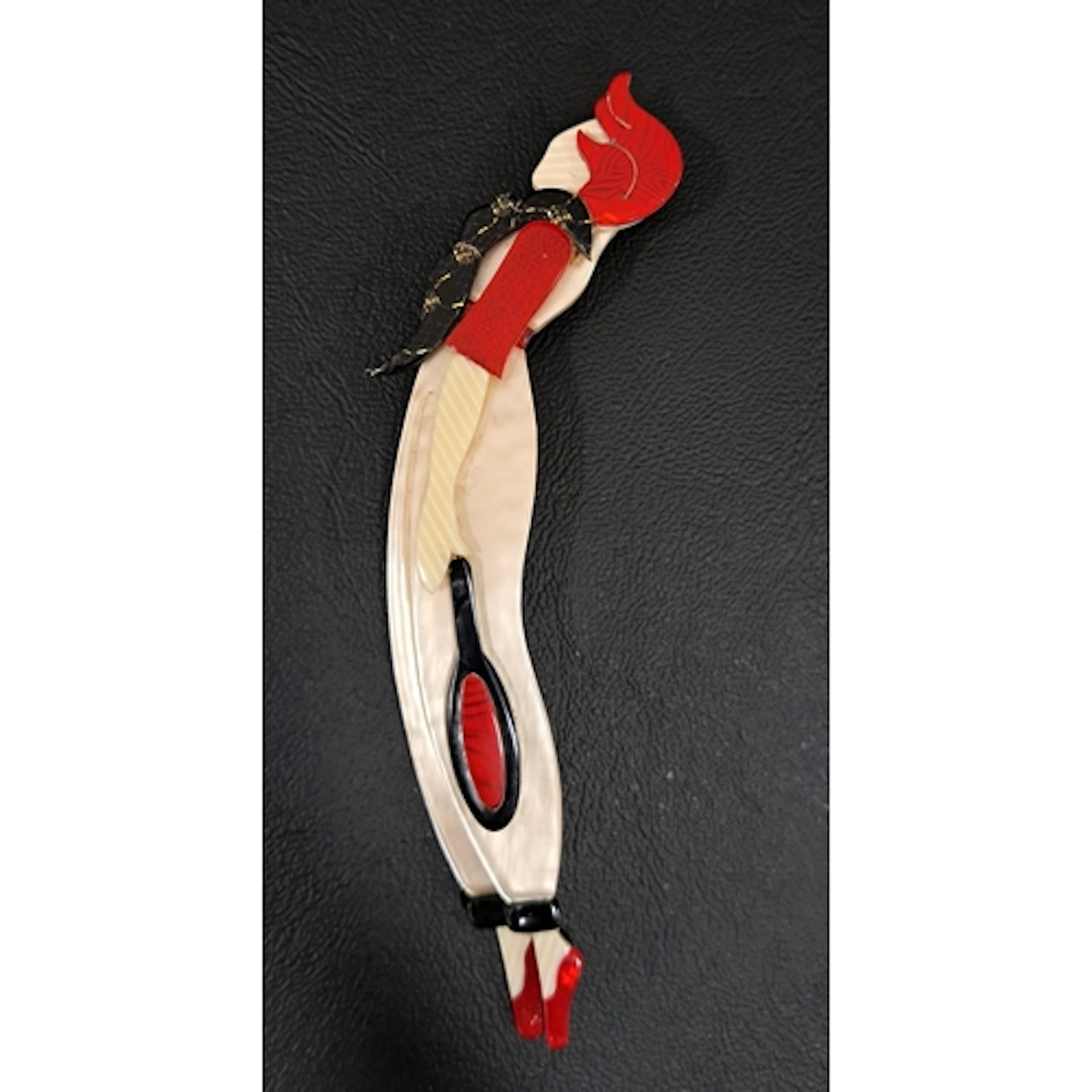 LEA STEIN TENNIS PLAYER BROOCH in tones of cream, red and bl...