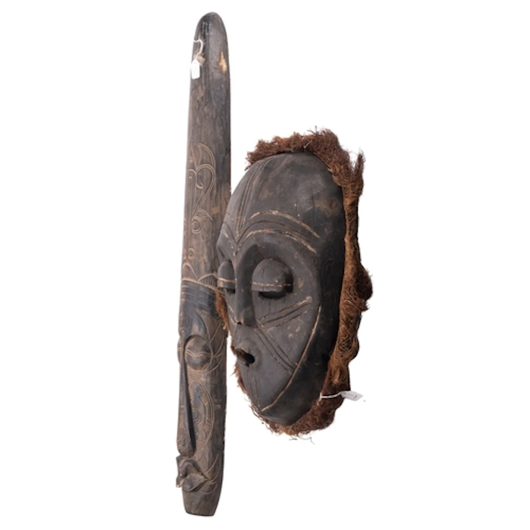 A tribal mask, possibly West or Central African, with line c...