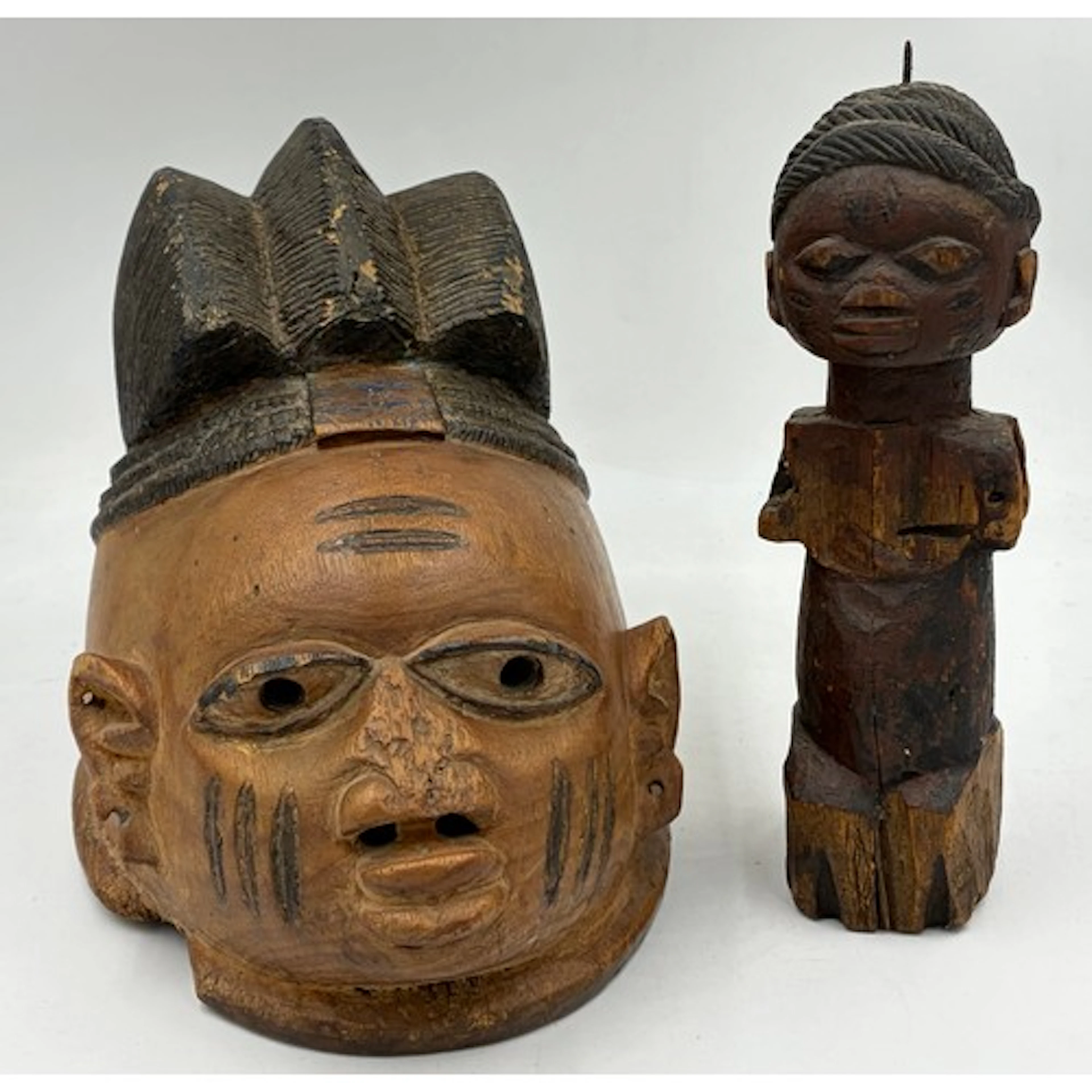 A carved and partially painted wood head dress 'Egungun' in ...
