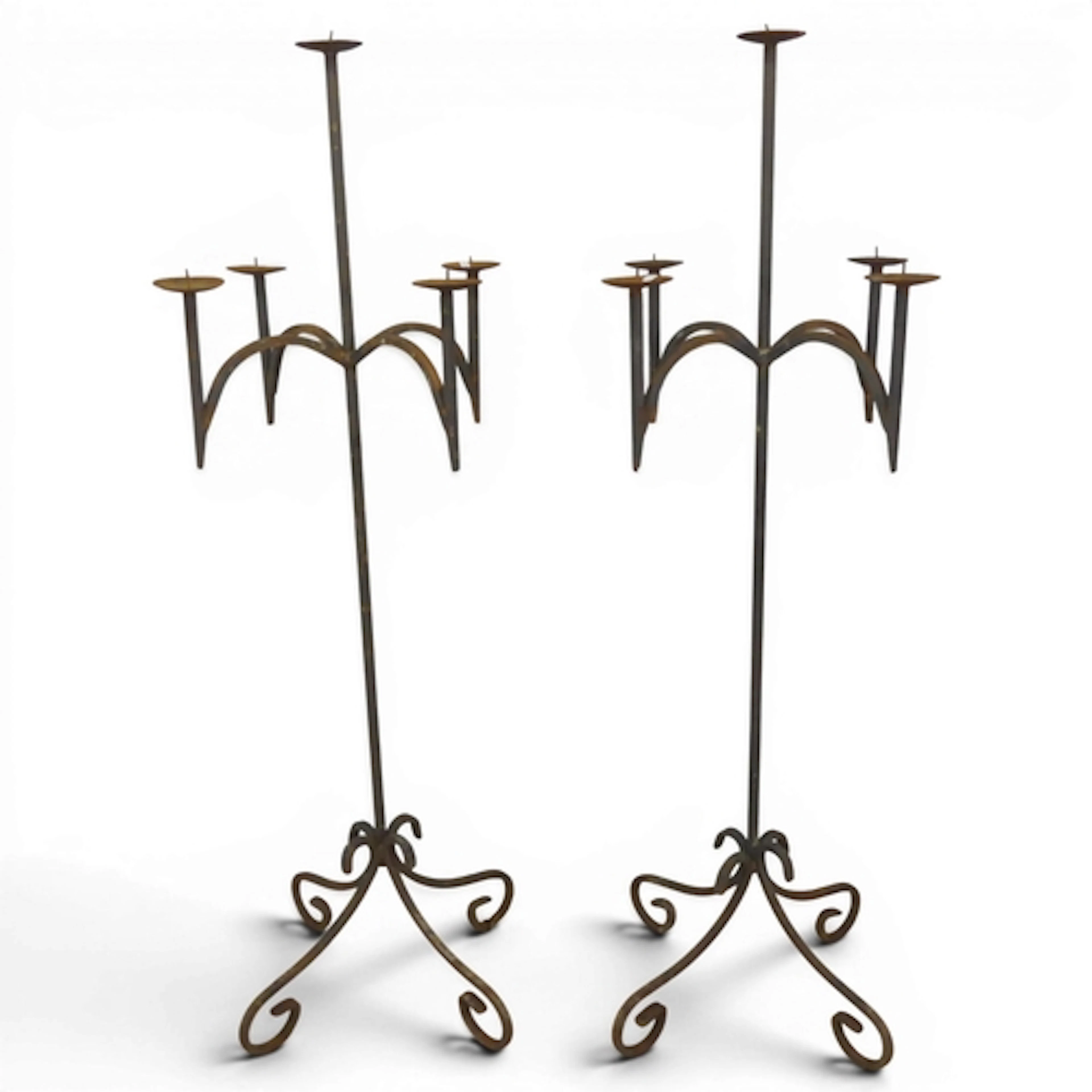 A pair of Gothic wrought iron floor standing candelabra. Hei...