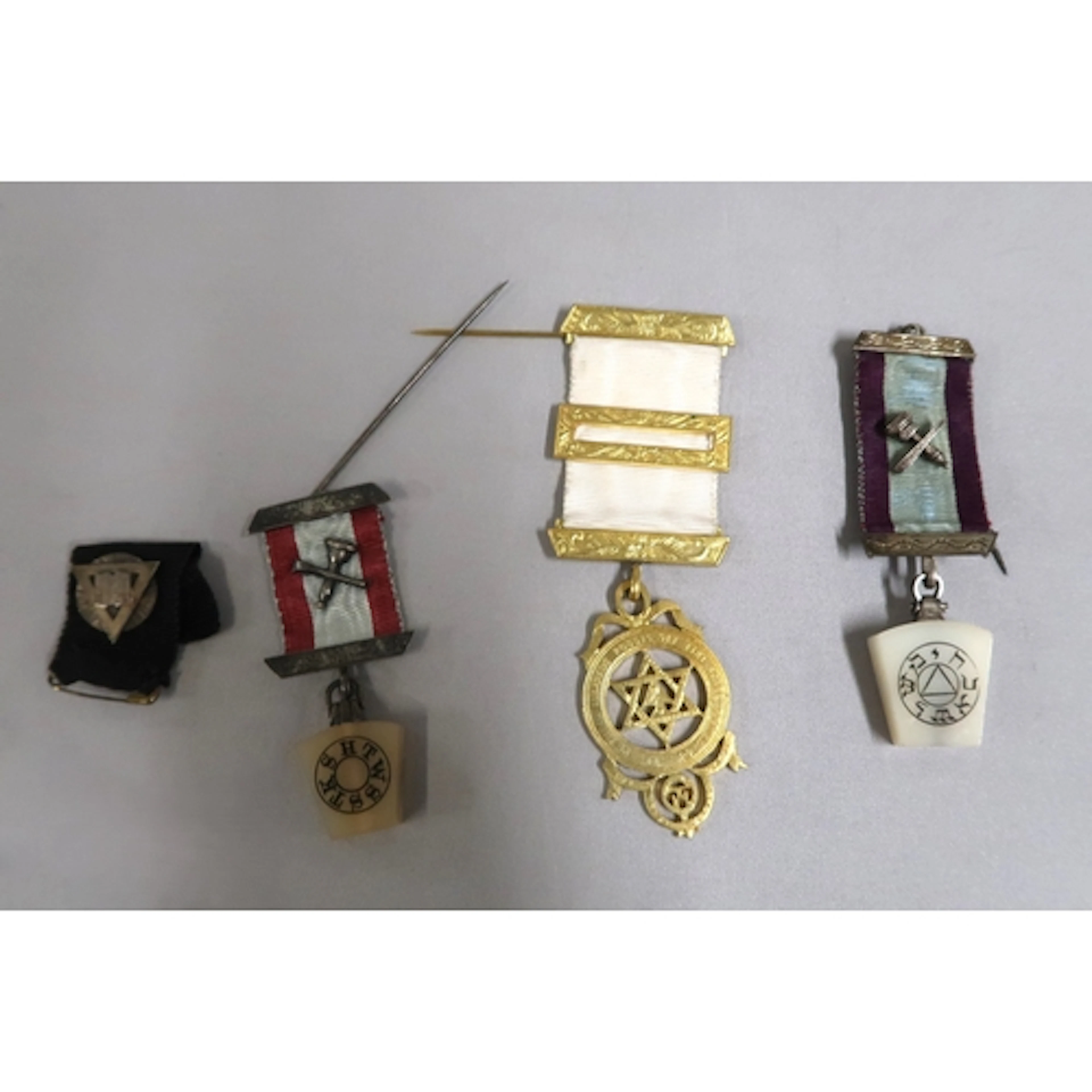 Four various Masonic medals with ribbons